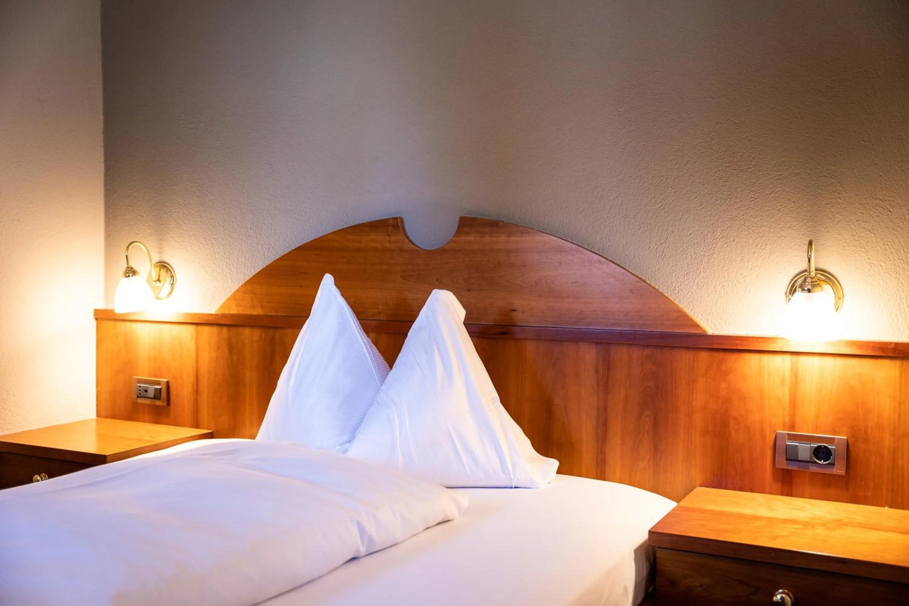 Bed in PanoramaHotel Penegal