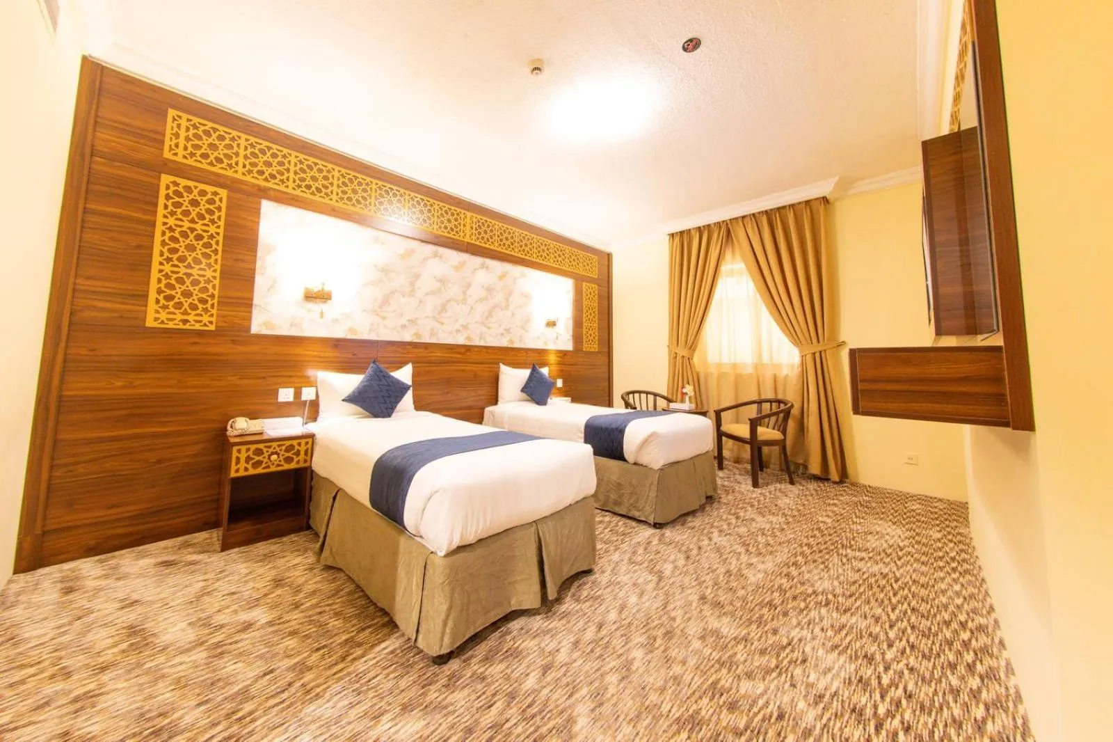 Bed in Abraj Al Tayseer Tuwa Hotel
