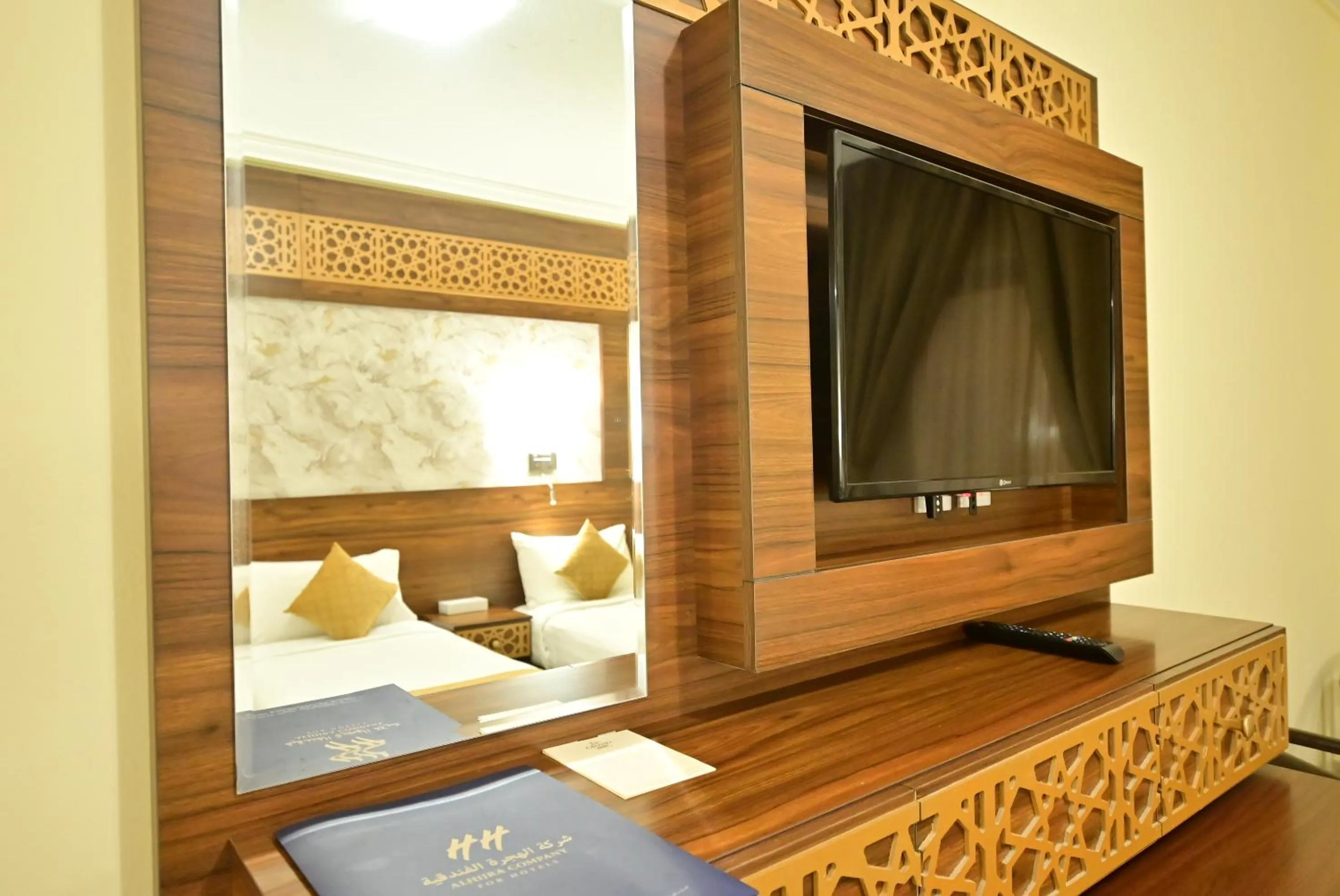 Bed in Abraj Al Tayseer Tuwa Hotel