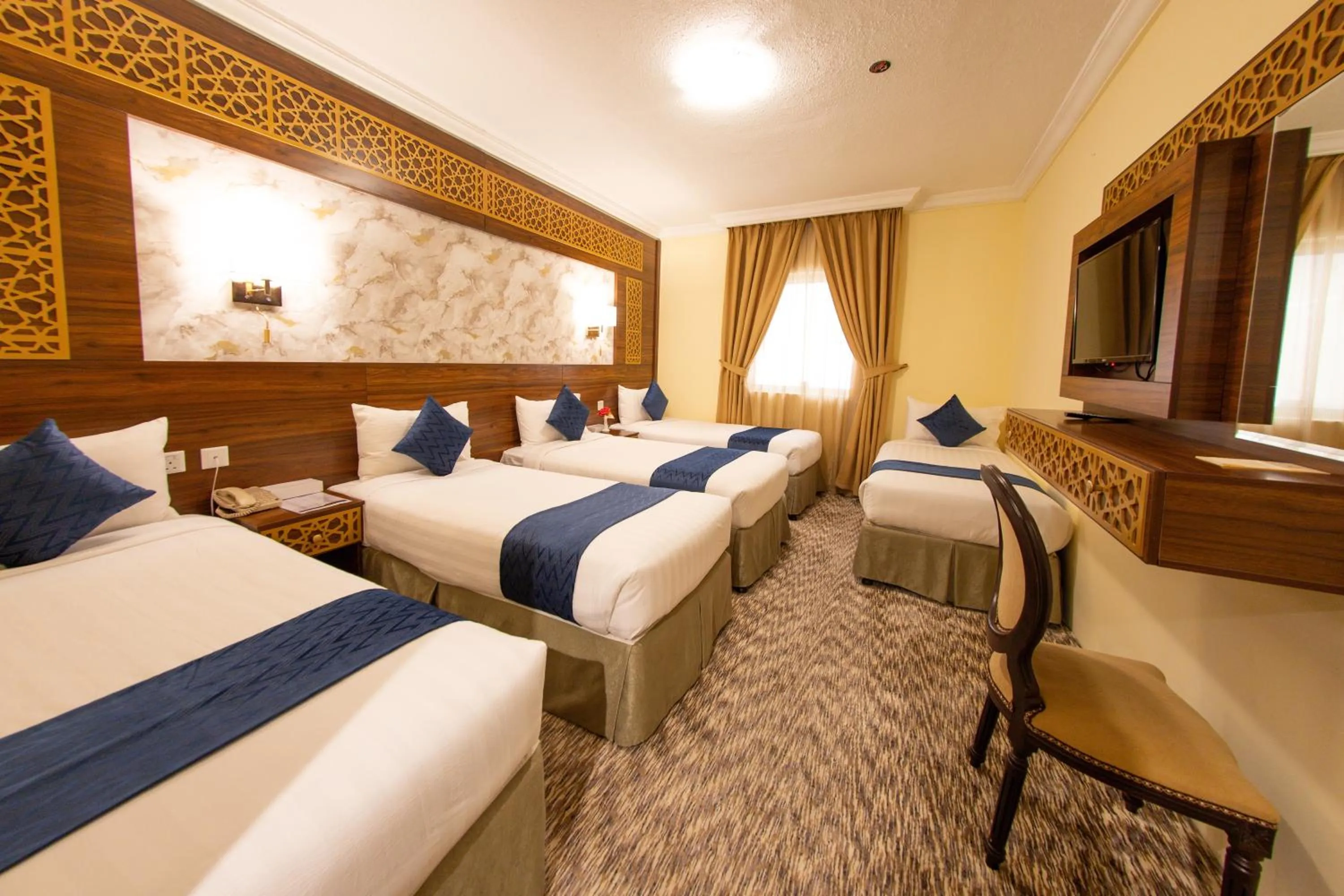 Bed in Abraj Al Tayseer Tuwa Hotel