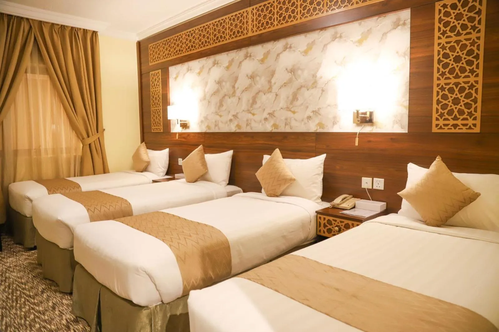 Bed in Abraj Al Tayseer Tuwa Hotel