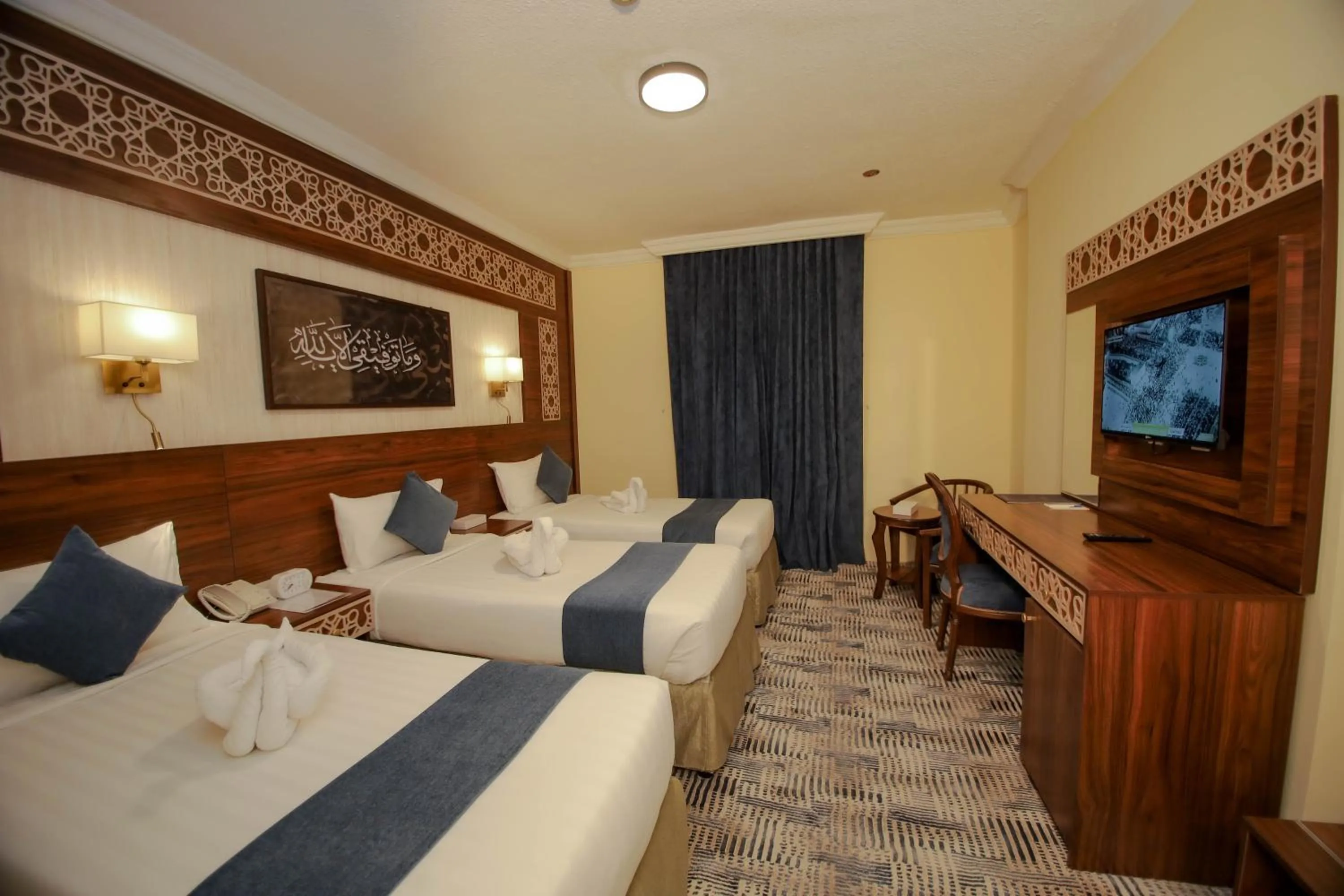 Bed in Abraj Al Tayseer Tuwa Hotel