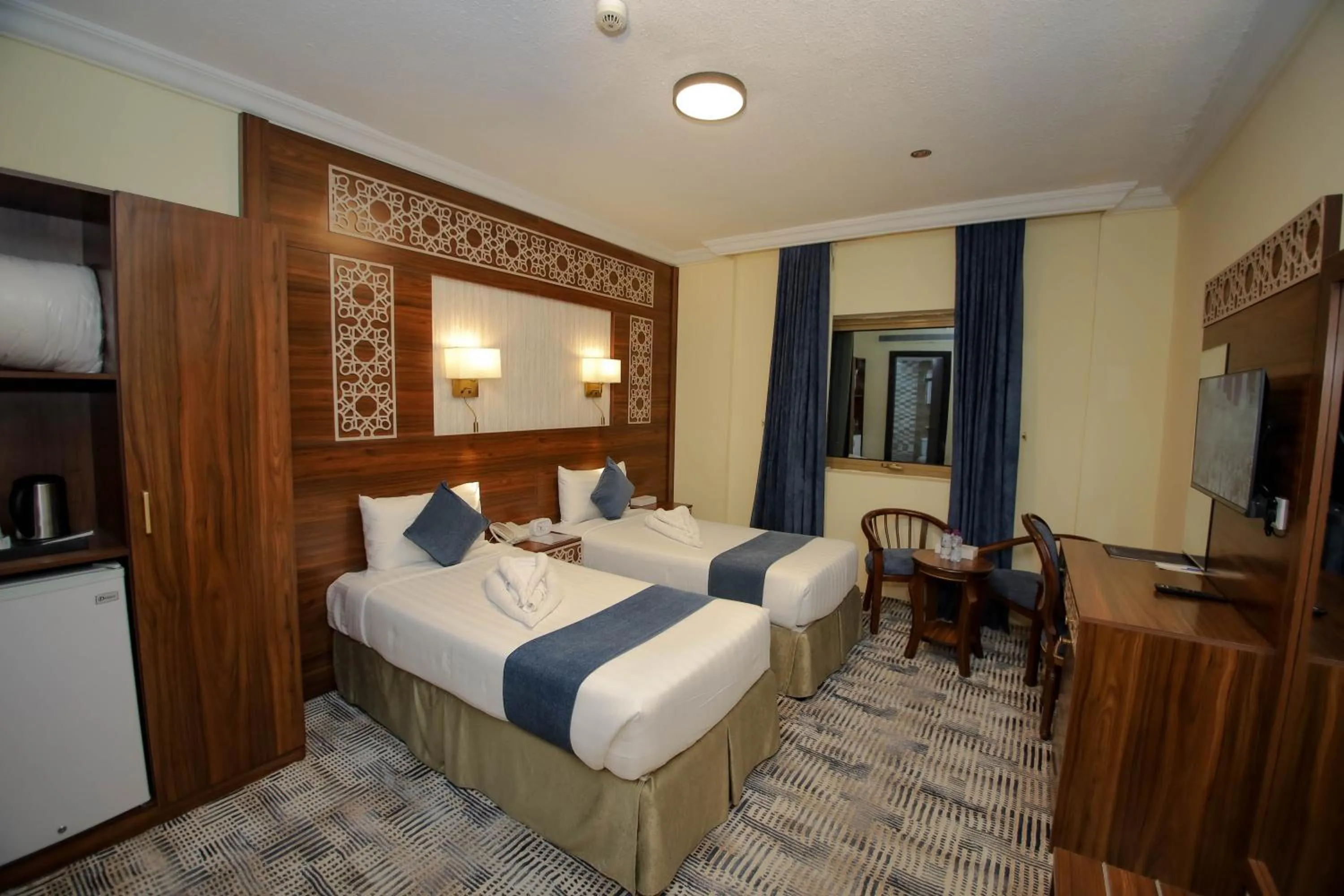 Bed in Abraj Al Tayseer Tuwa Hotel