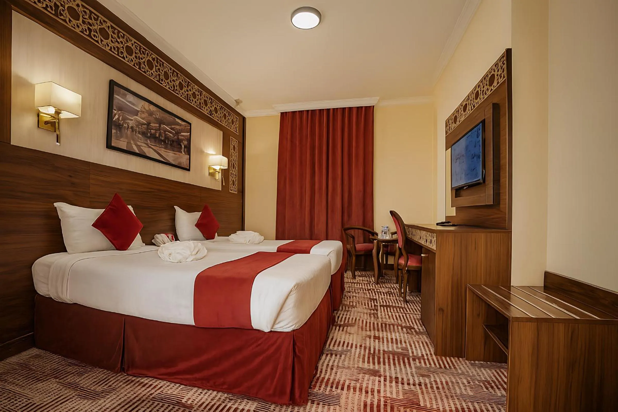 Bed in Abraj Al Tayseer Tuwa Hotel