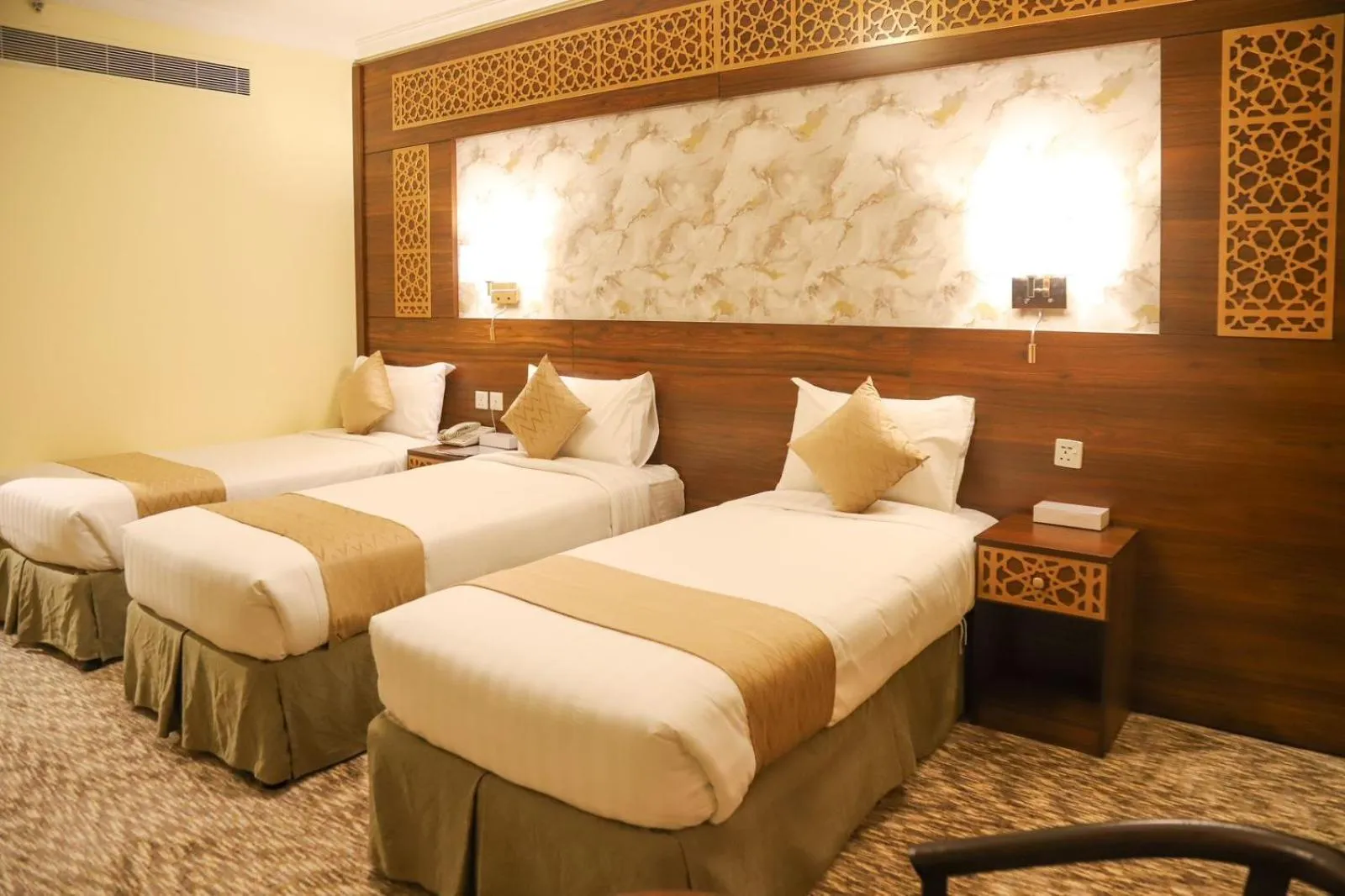 Bed in Abraj Al Tayseer Tuwa Hotel