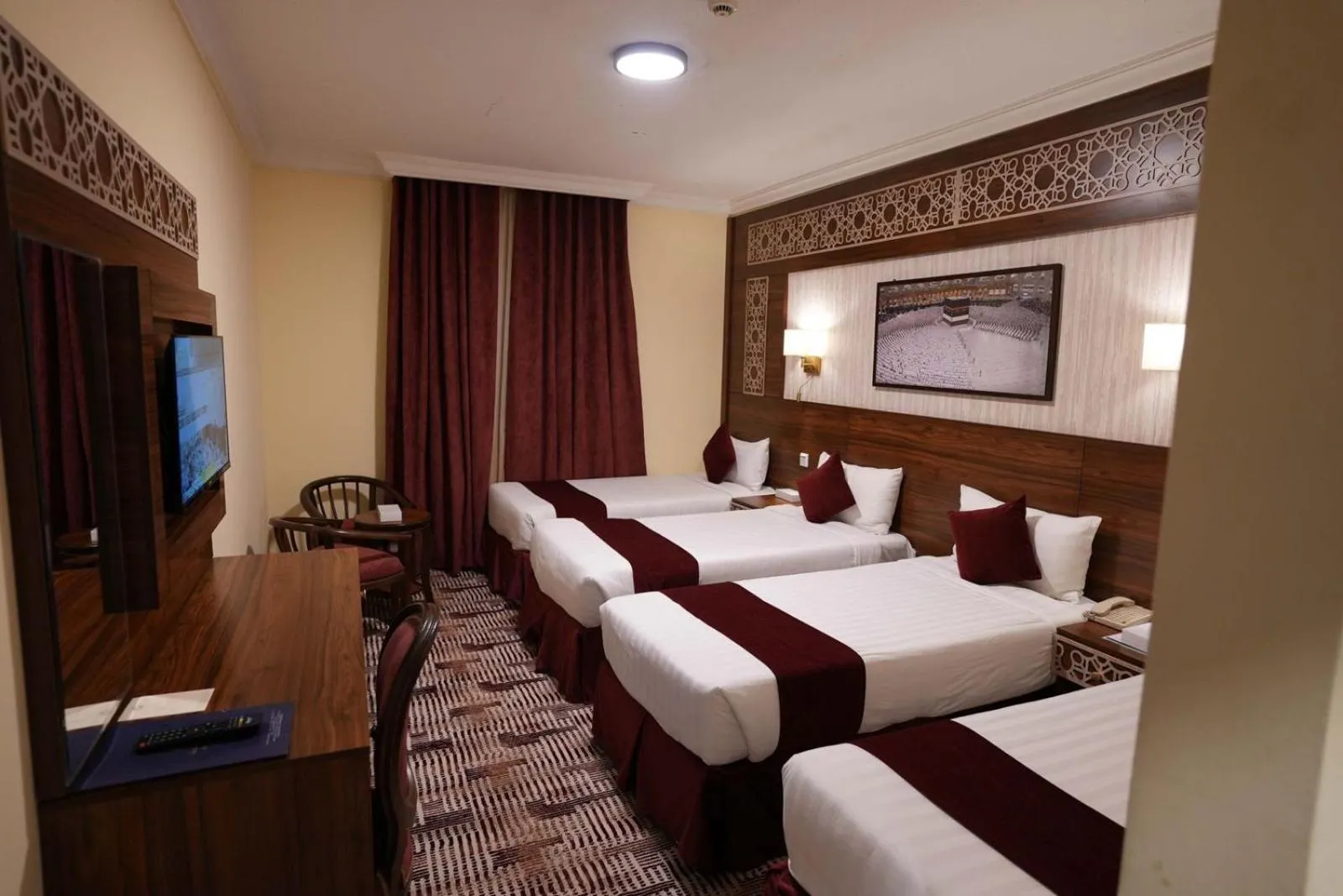 Bed in Abraj Al Tayseer Tuwa Hotel