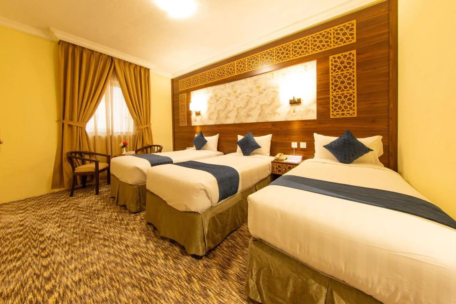 Bed in Abraj Al Tayseer Tuwa Hotel
