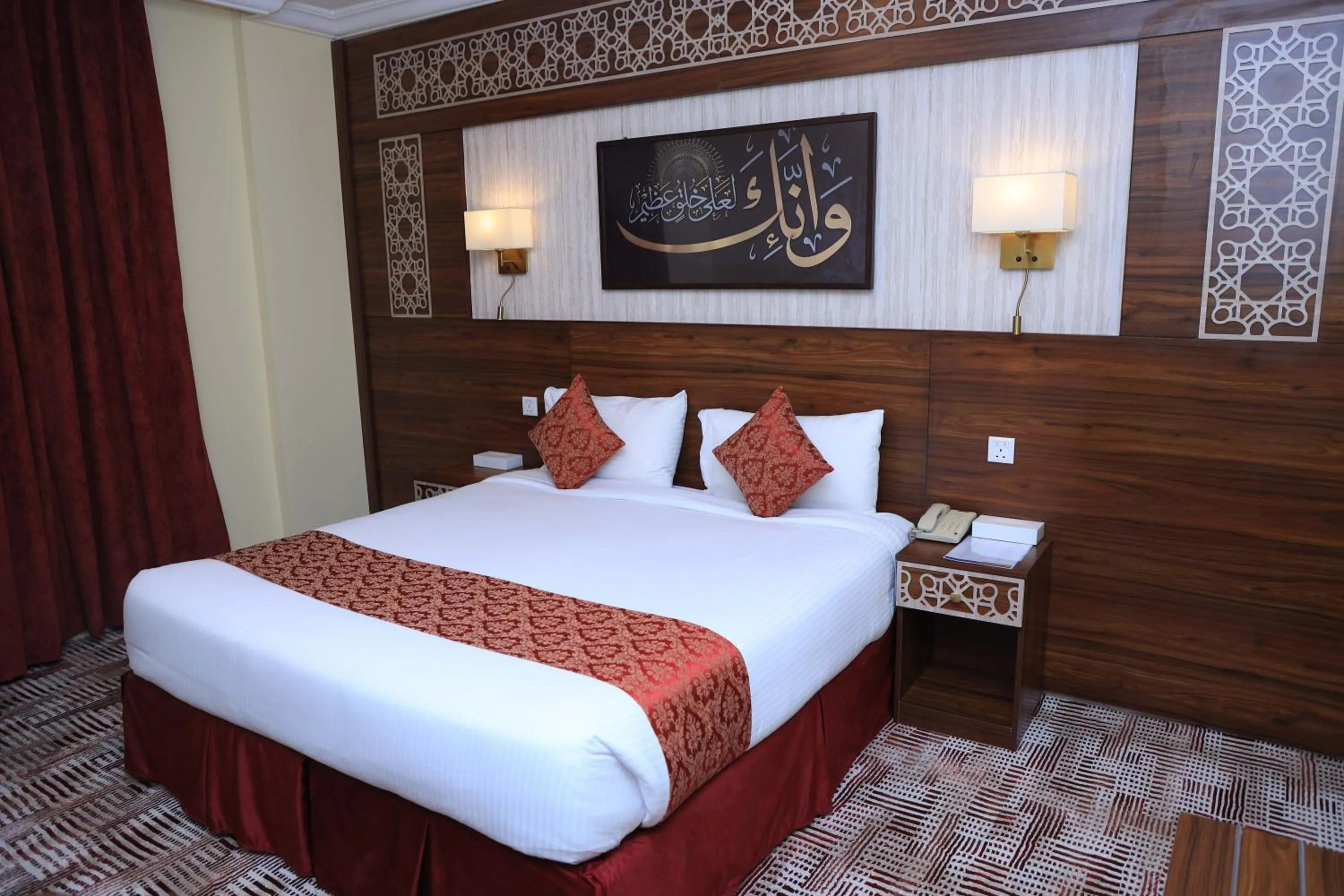 Bed in Abraj Al Tayseer Tuwa Hotel