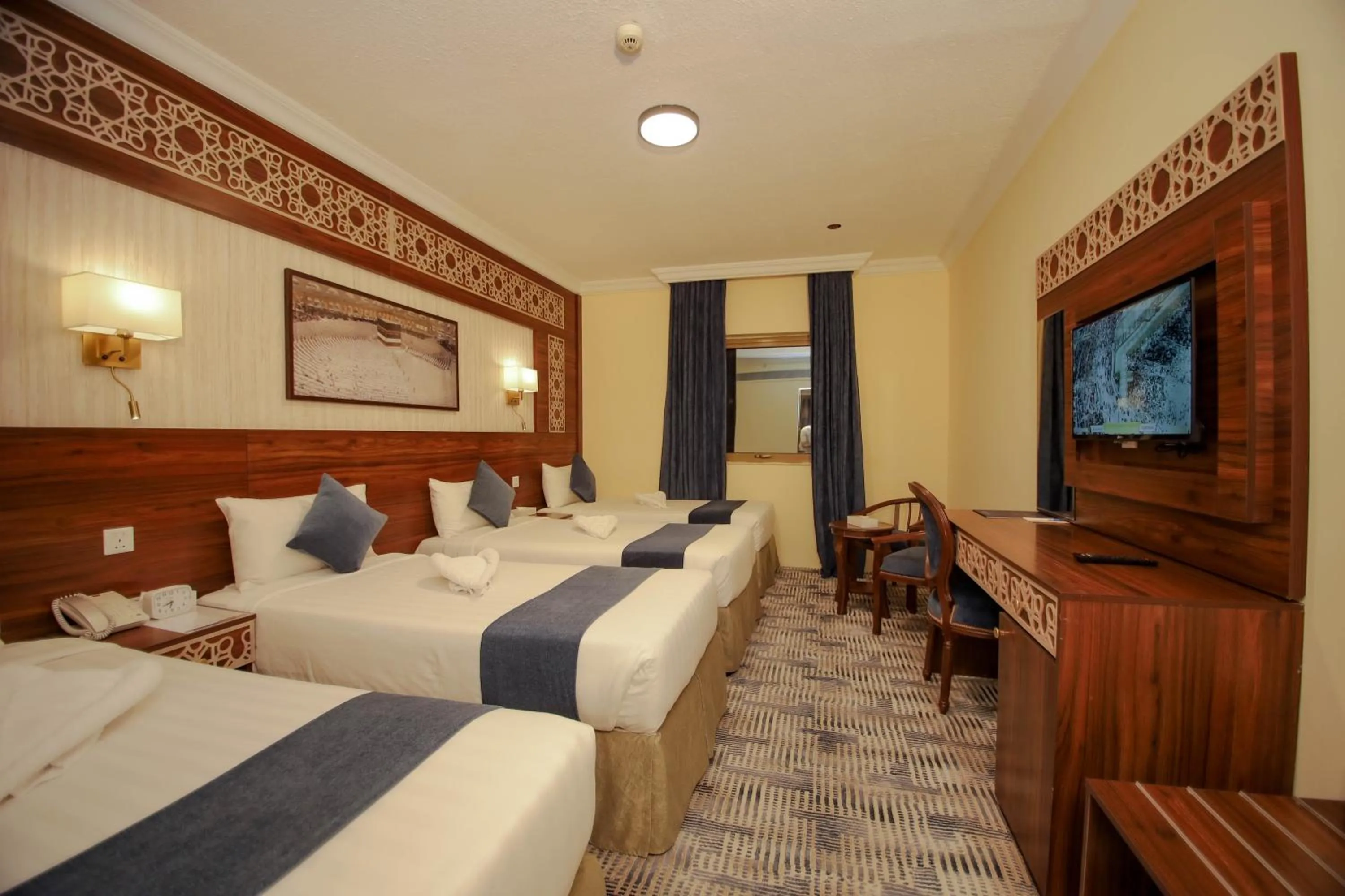 Bed in Abraj Al Tayseer Tuwa Hotel
