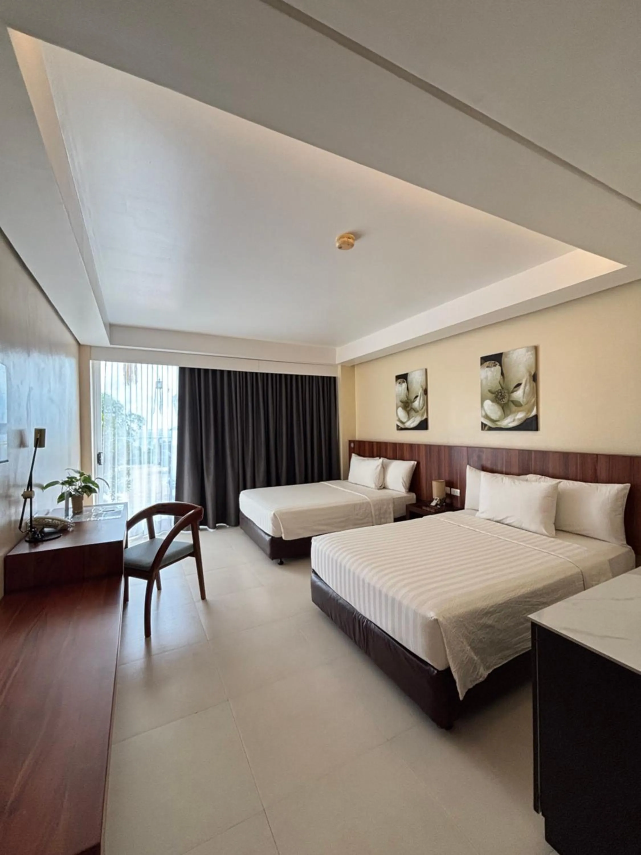 Bed in Ocean Suites Bohol Boutique Hotel