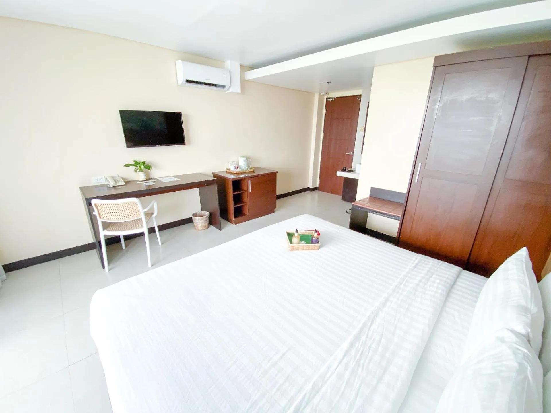 Bed in Ocean Suites Bohol Boutique Hotel