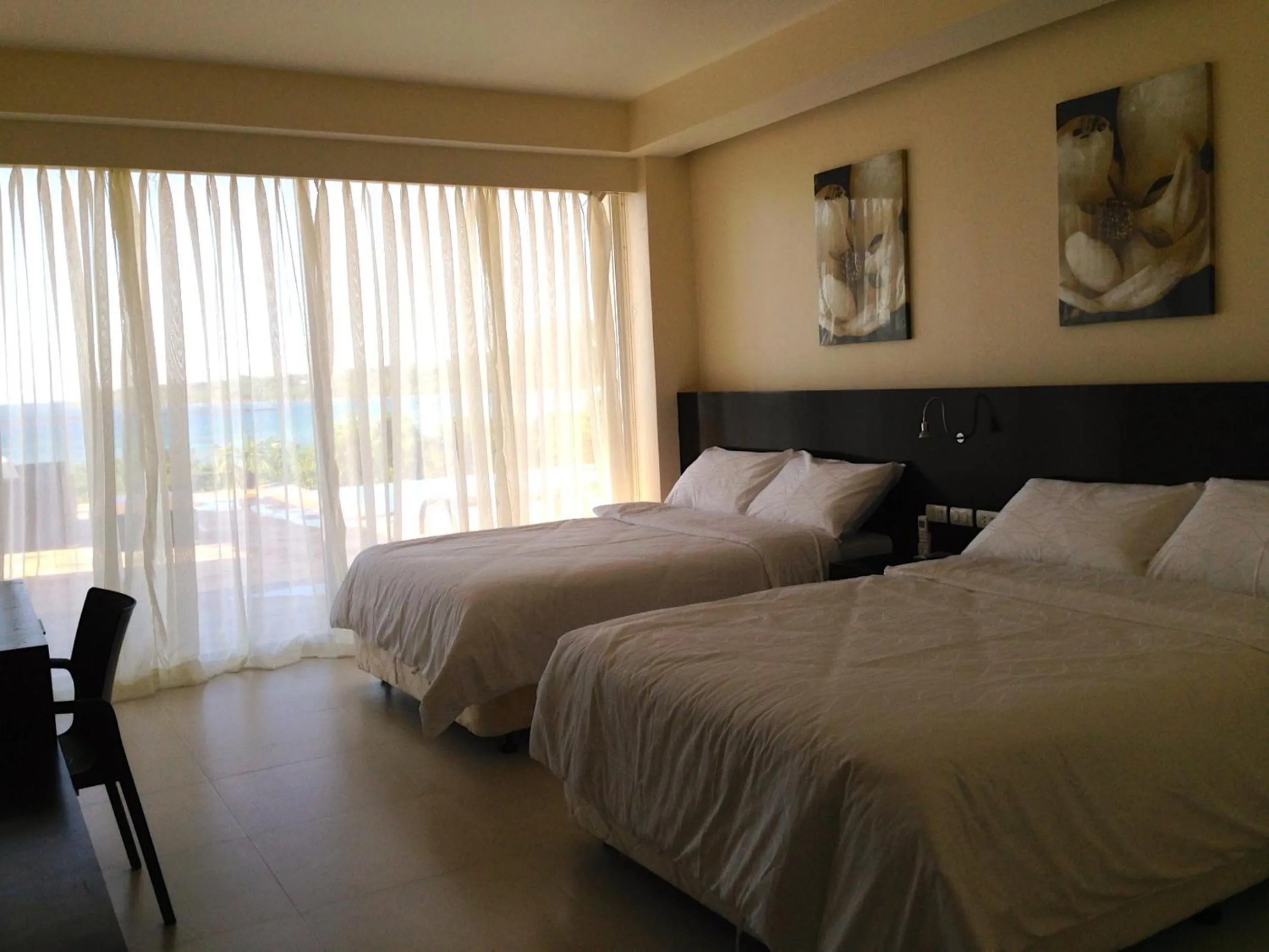 Shower, Bed in Ocean Suites Bohol Boutique Hotel