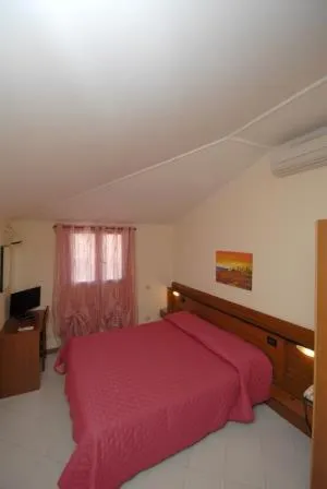 Bed in Hotel Baia Del Sorriso