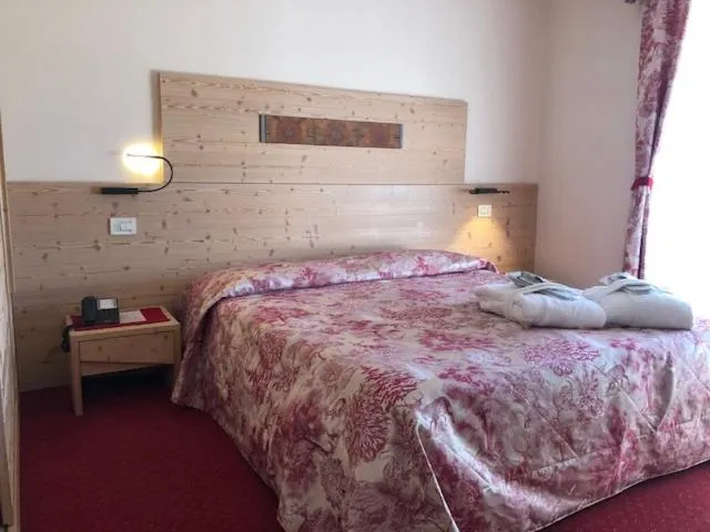 Bed in Hotel Paradiso