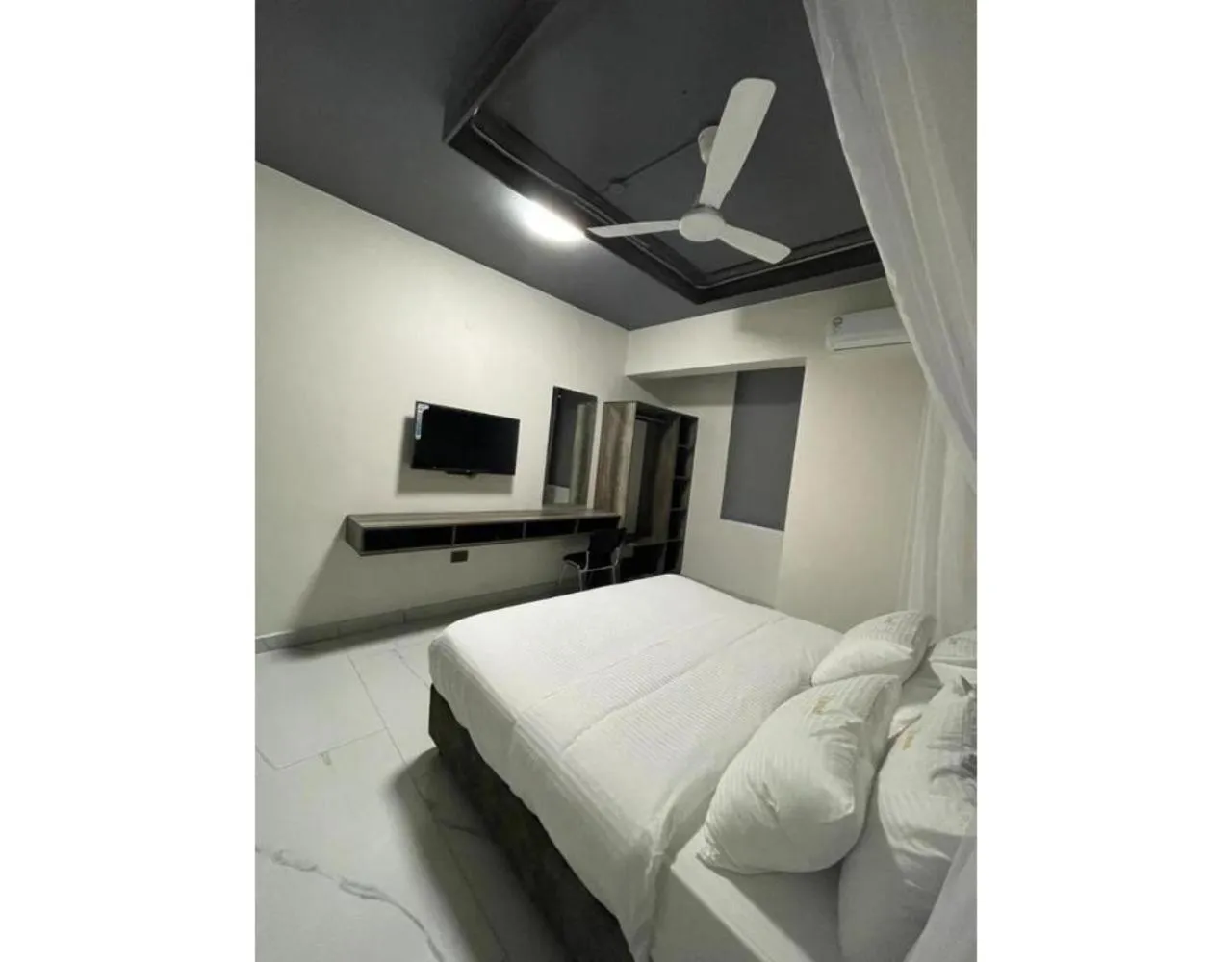 Bed in The Ivory Suites