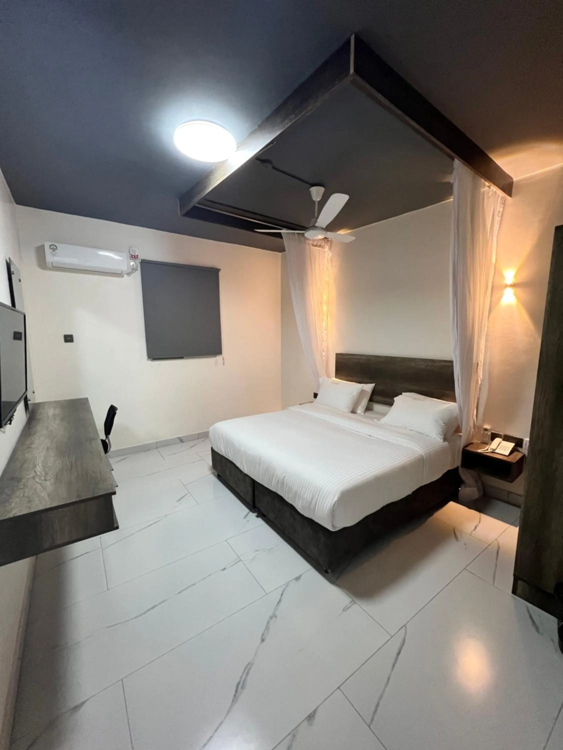 Bed in The Ivory Suites