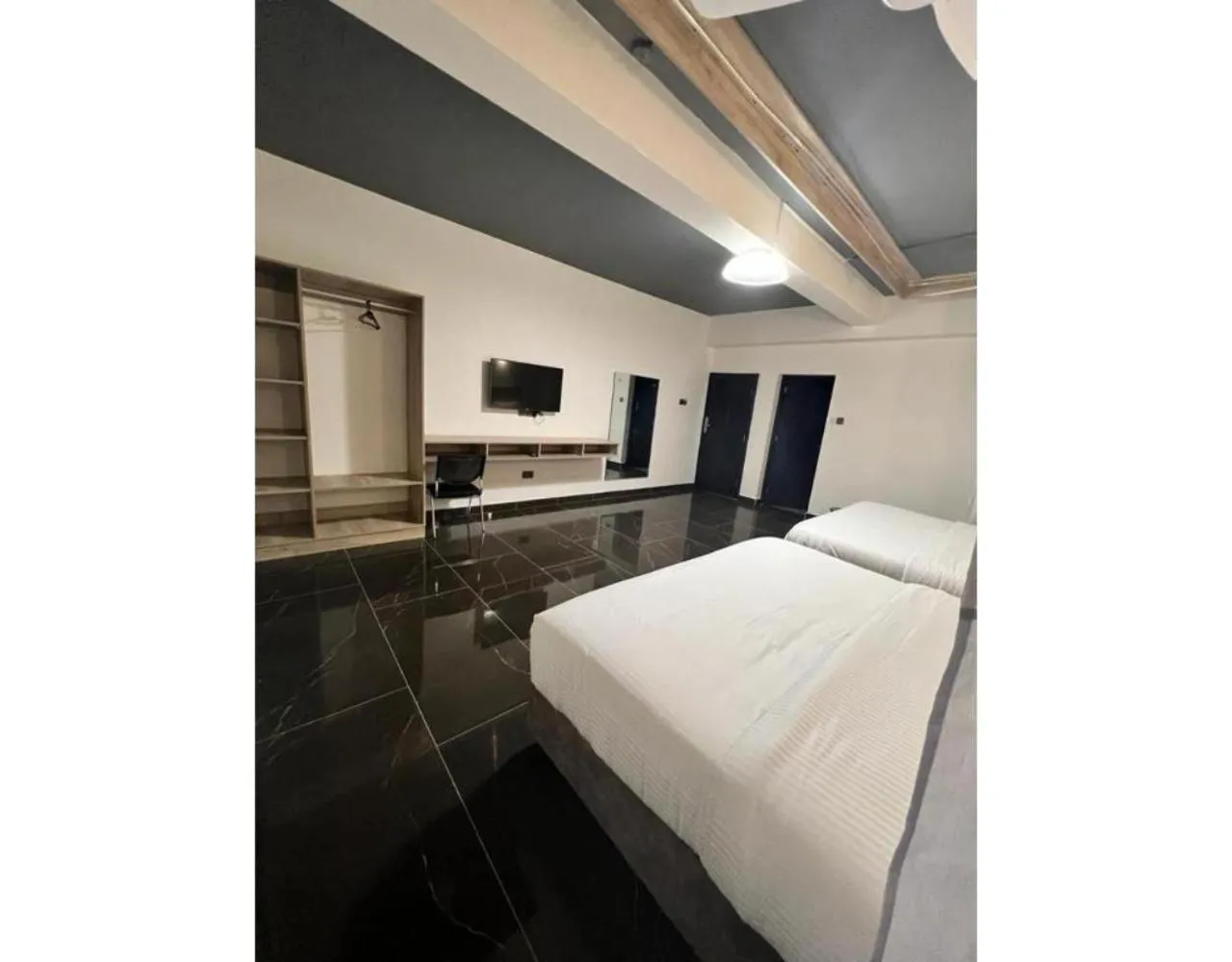 Bed in The Ivory Suites