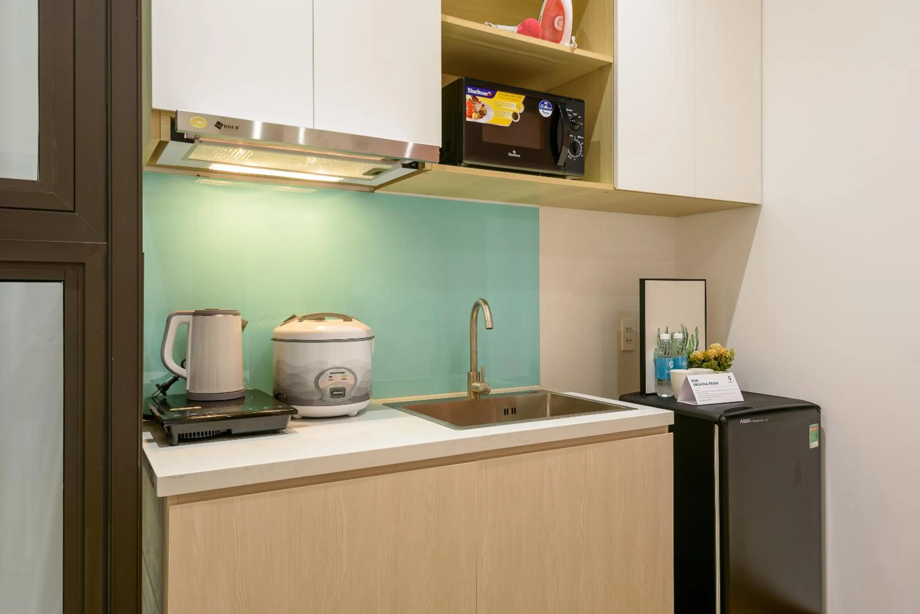 Kitchen or kitchenette in Cozrum Homes - June Corner