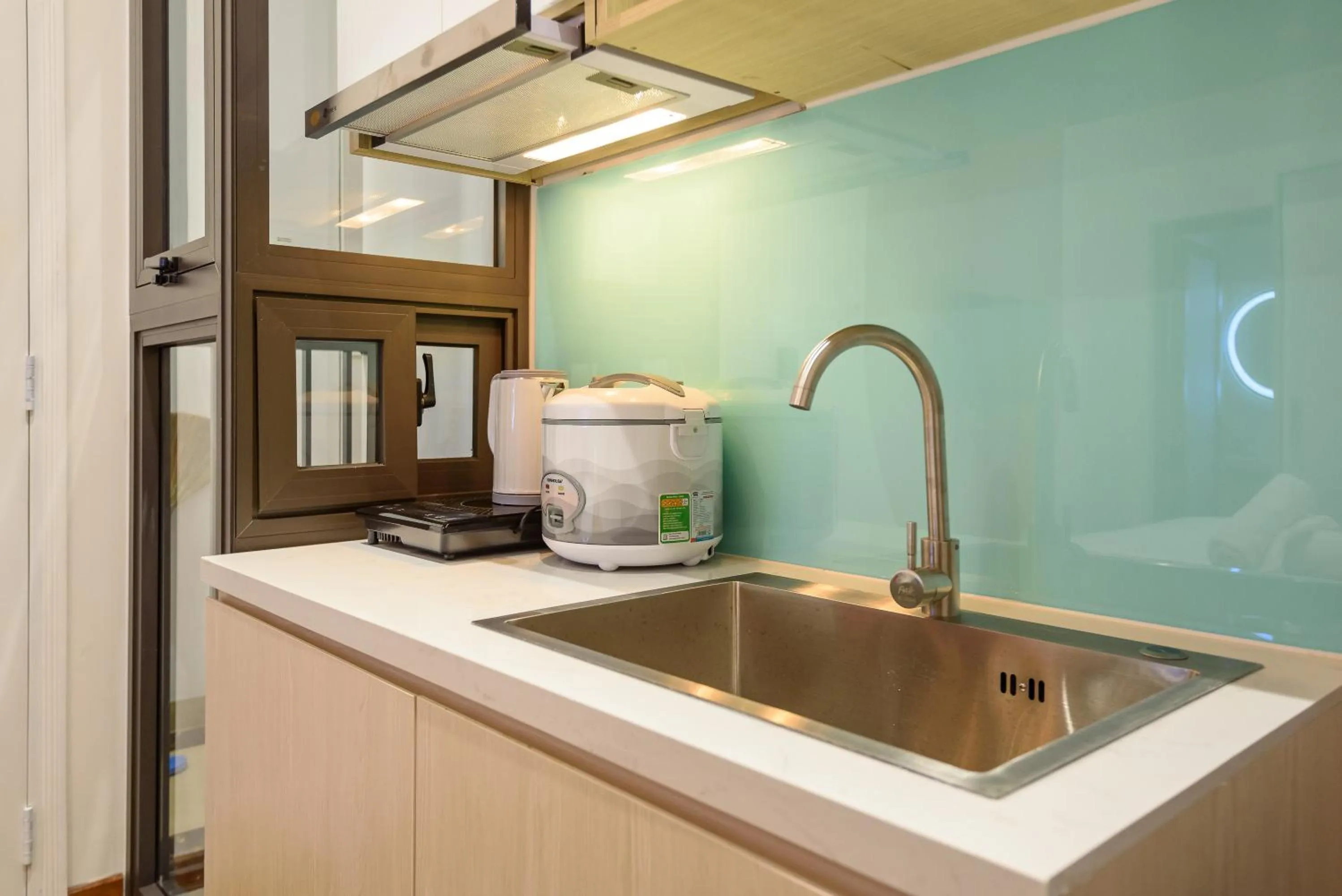 Kitchen or kitchenette in Cozrum Homes - June Corner