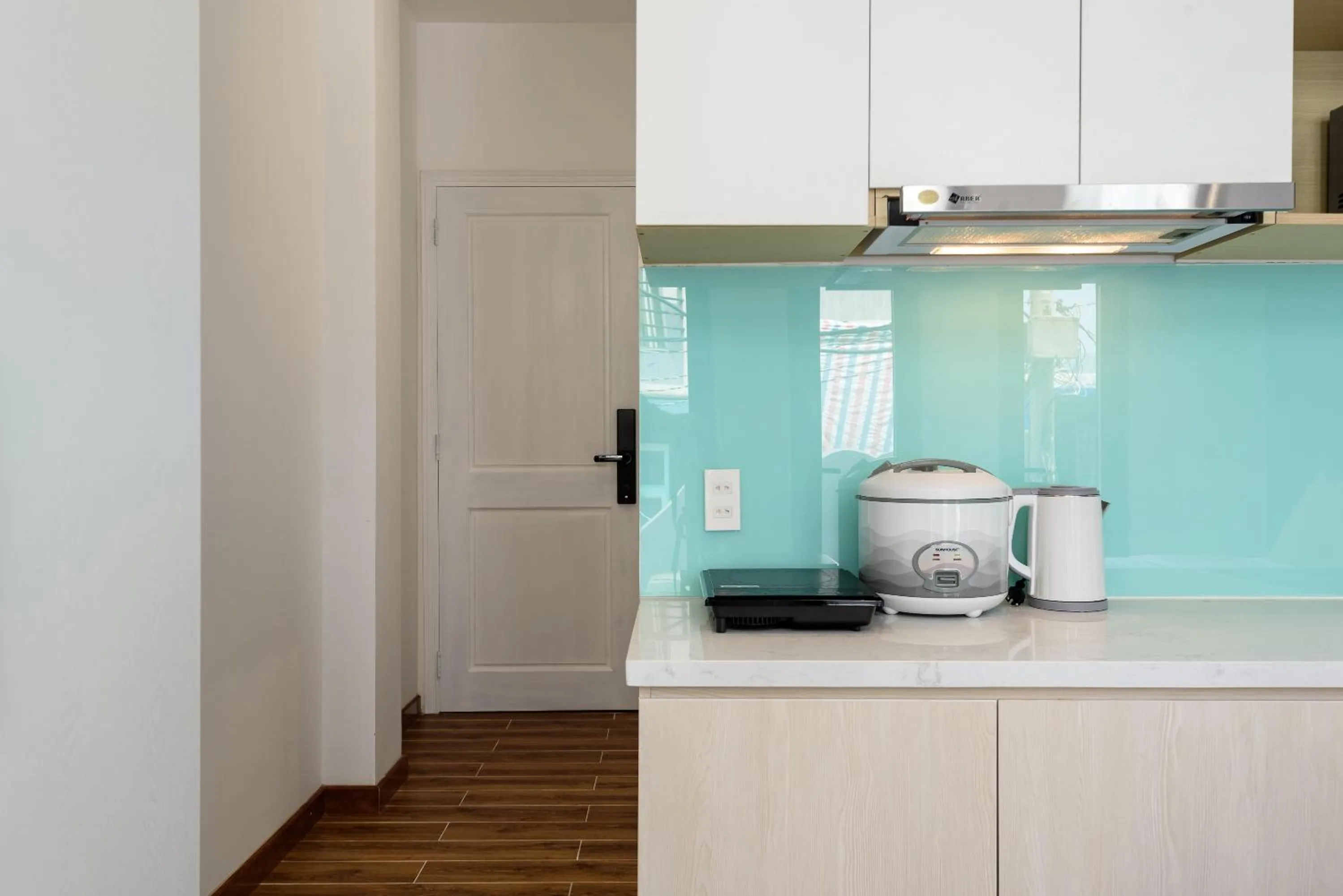 Kitchen or kitchenette in Cozrum Homes - June Corner