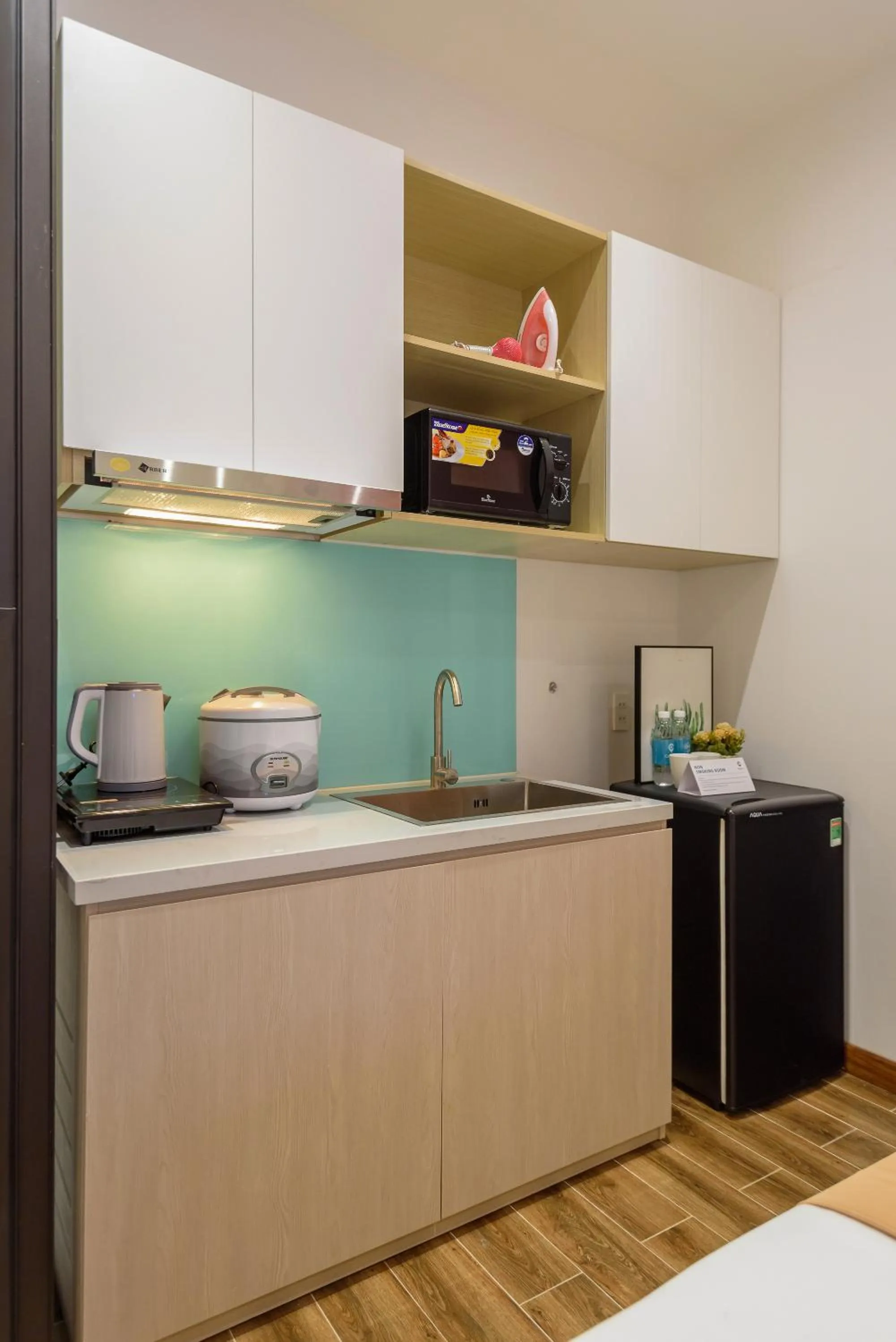 Kitchen or kitchenette in Cozrum Homes - June Corner