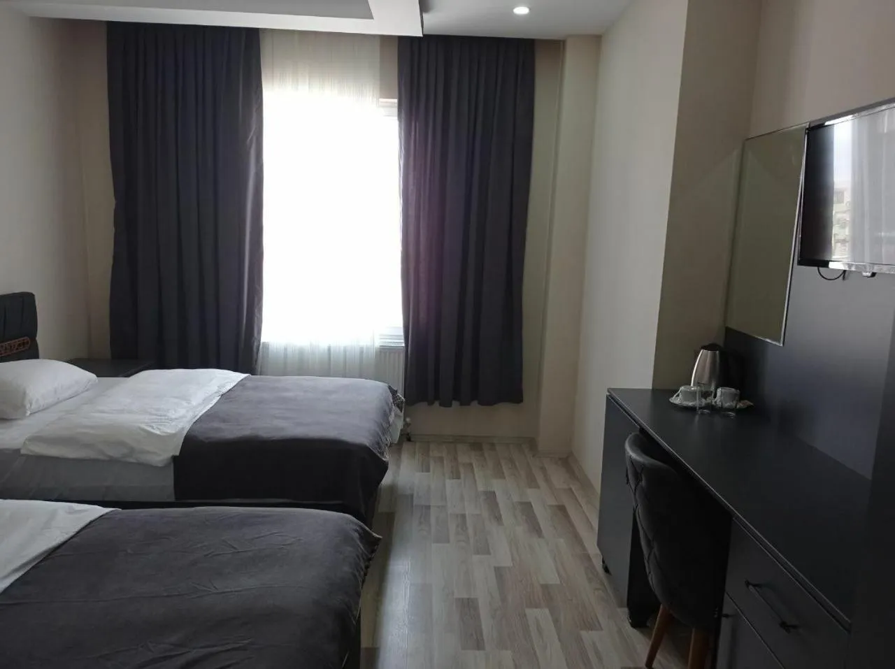 Bed in ATLIHAN PLUS HOTEL