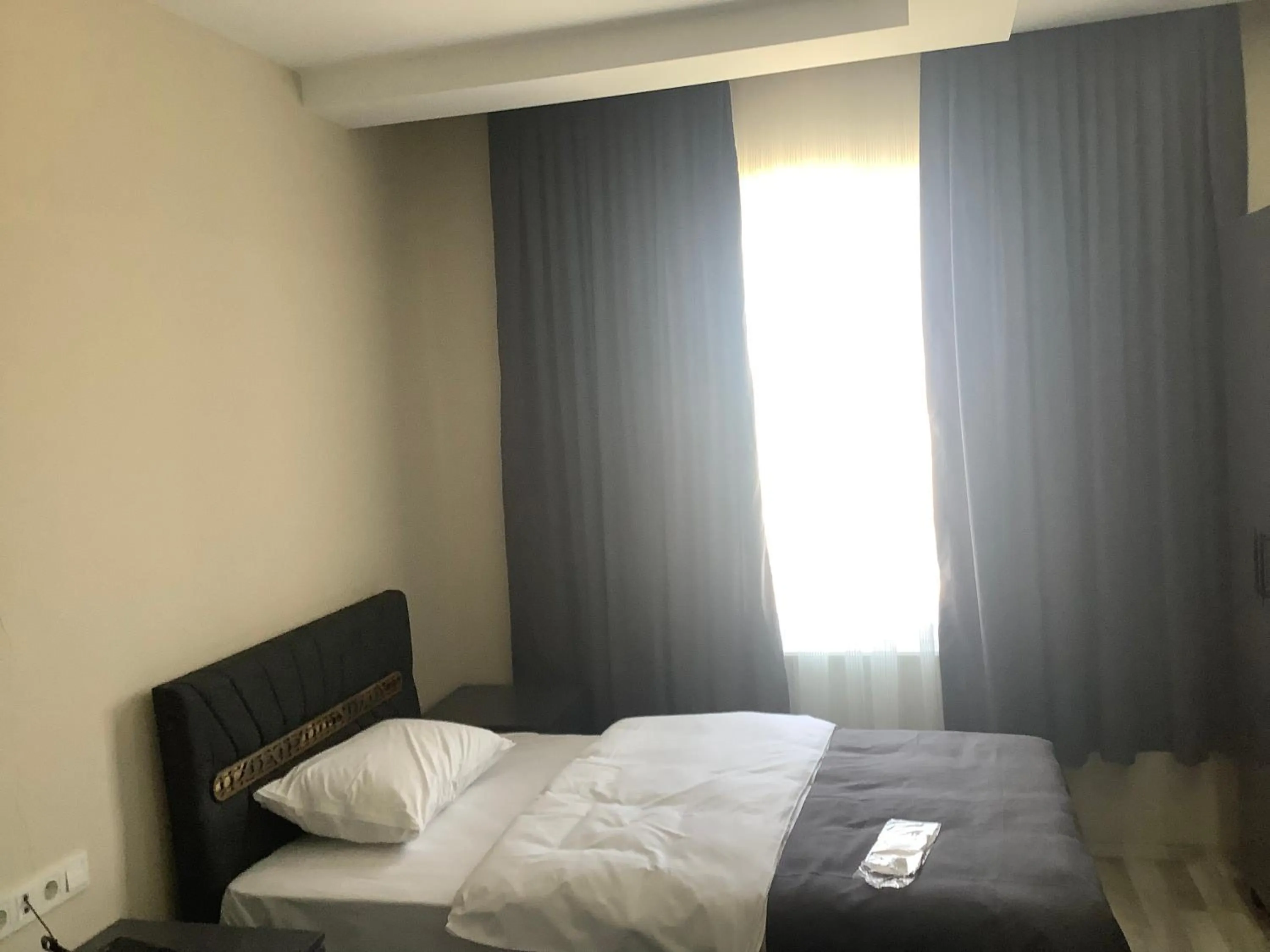 Bed in ATLIHAN PLUS HOTEL