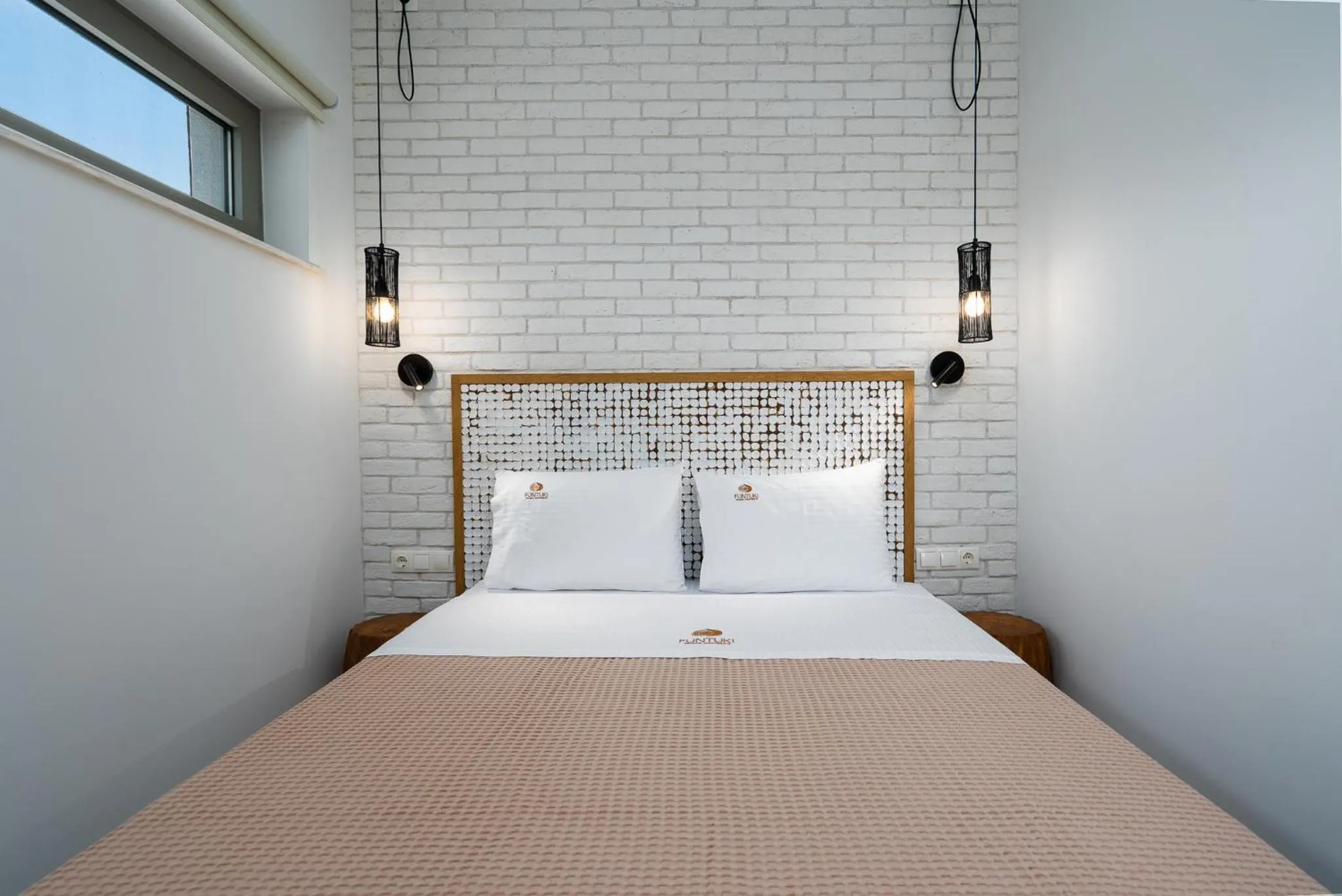 Bed in Funtuki Seaside Apartments