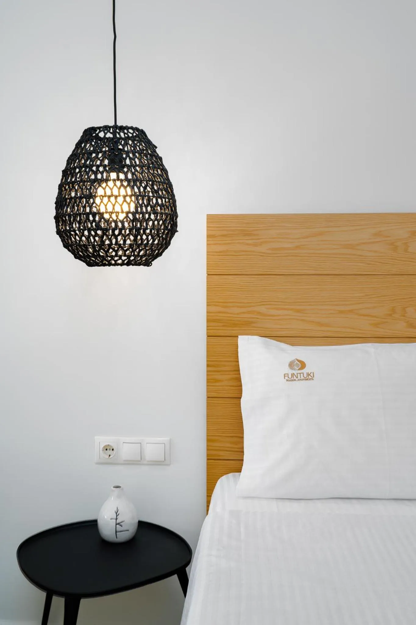 Bed in Funtuki Seaside Apartments