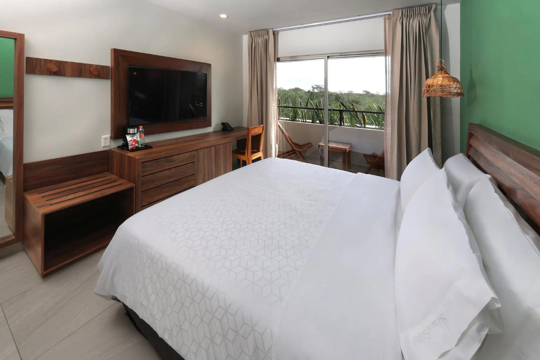 Photo of the whole room, Bed in Holiday Inn Tulum by IHG