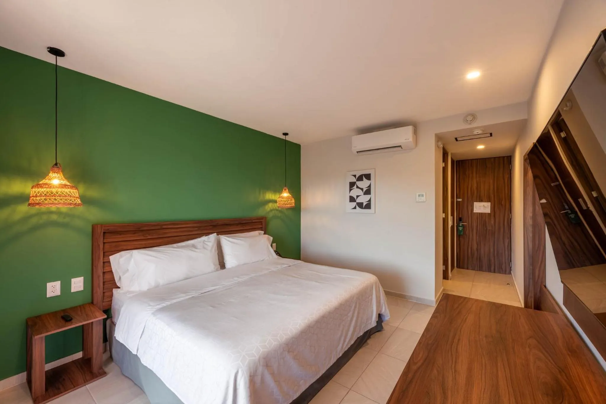 Photo of the whole room, Bed in Holiday Inn Tulum by IHG