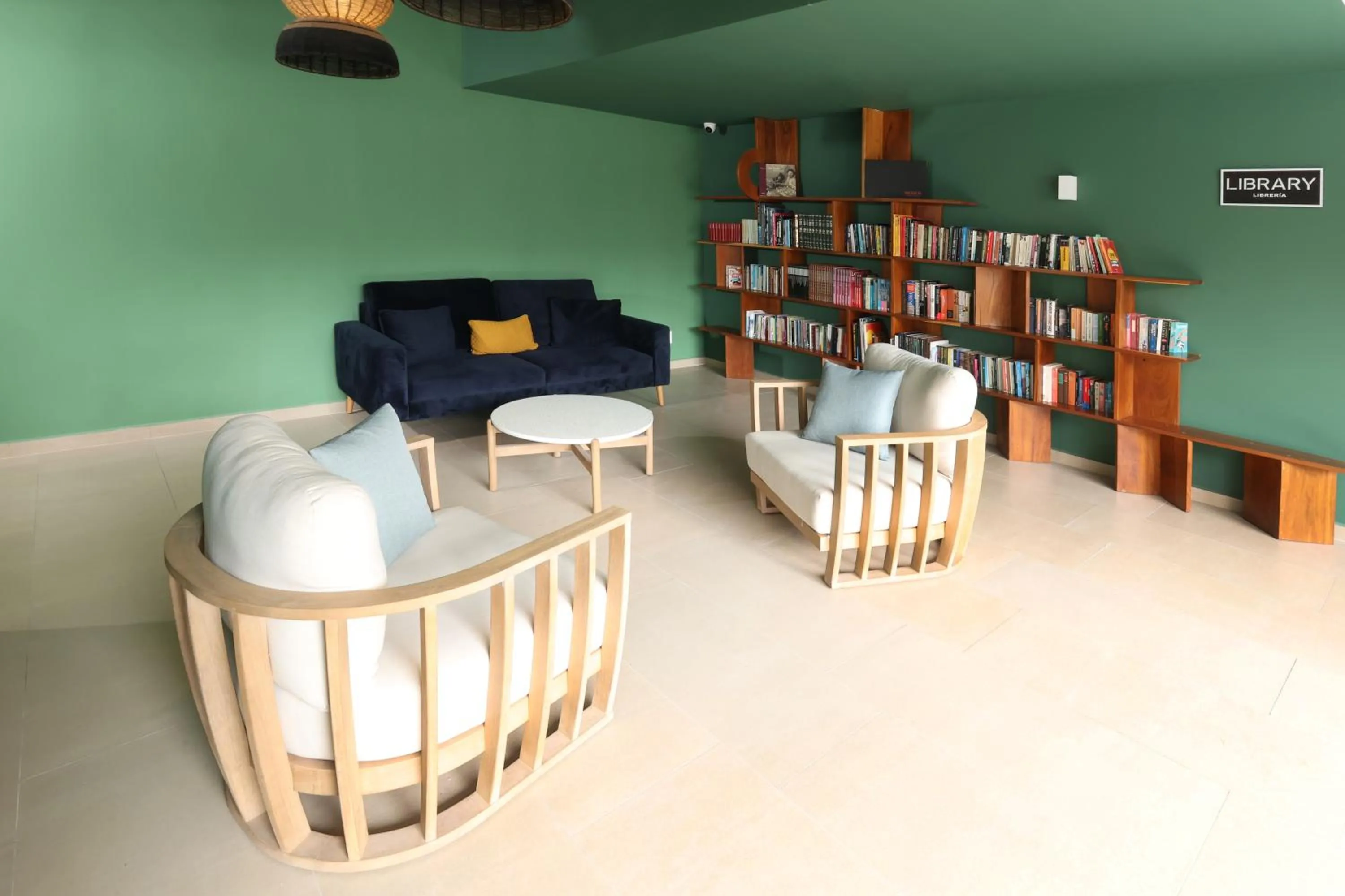 Library in Holiday Inn Tulum by IHG