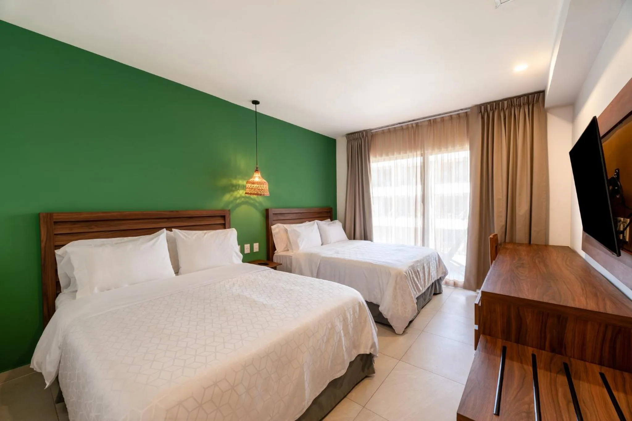 Photo of the whole room, Bed in Holiday Inn Tulum by IHG