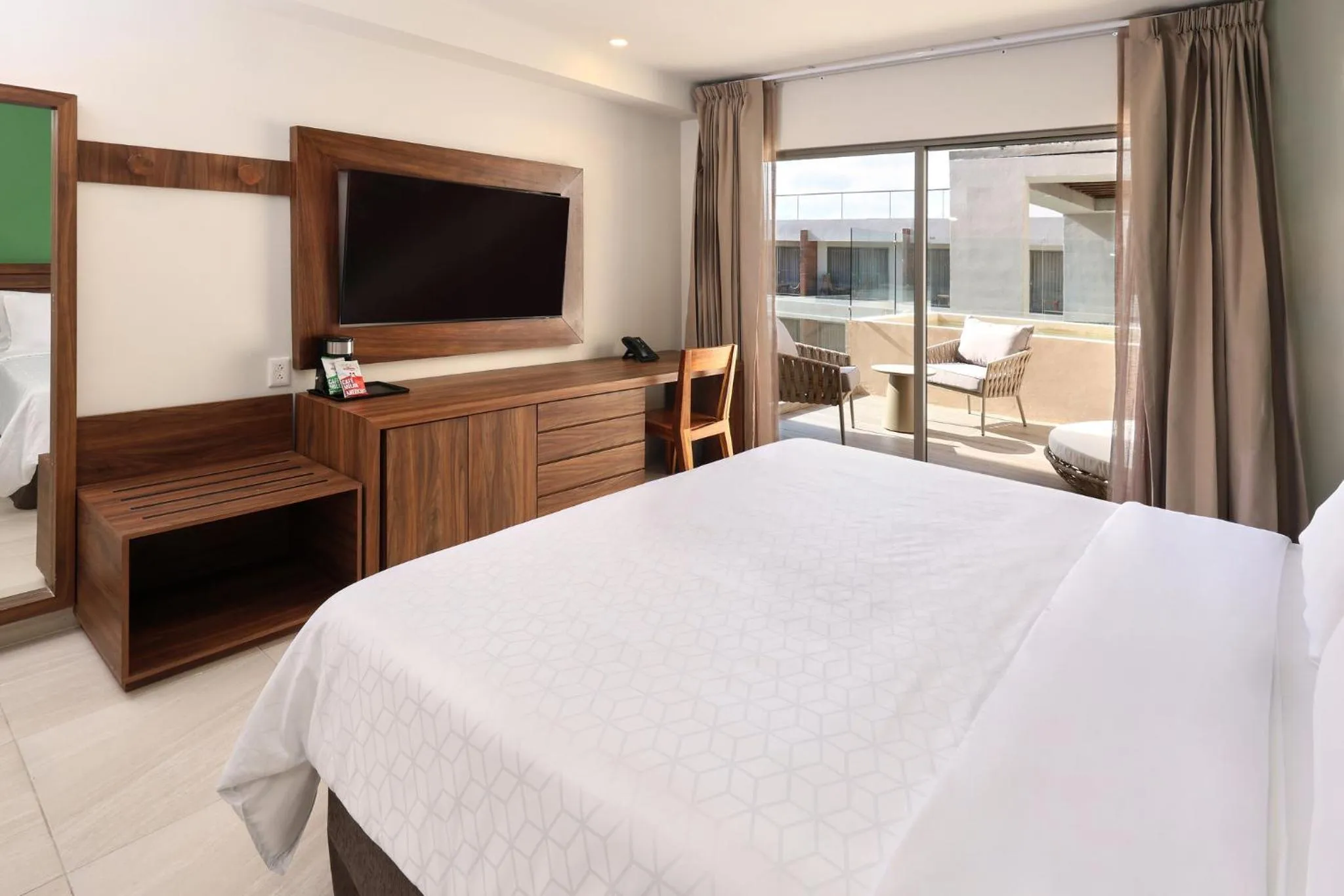 Photo of the whole room, Bed in Holiday Inn Tulum by IHG