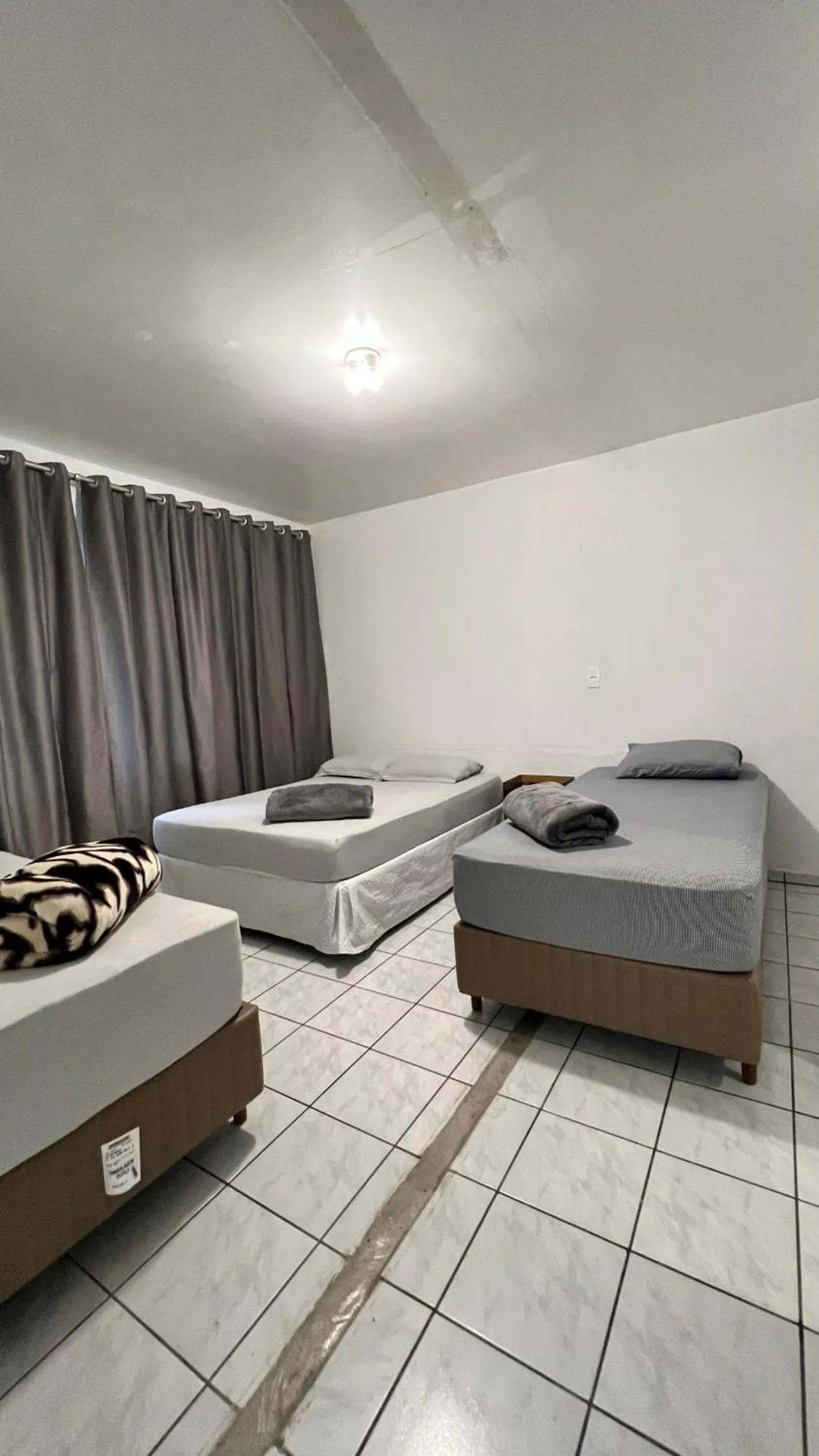 Bed in Pousada Central Jaraguá