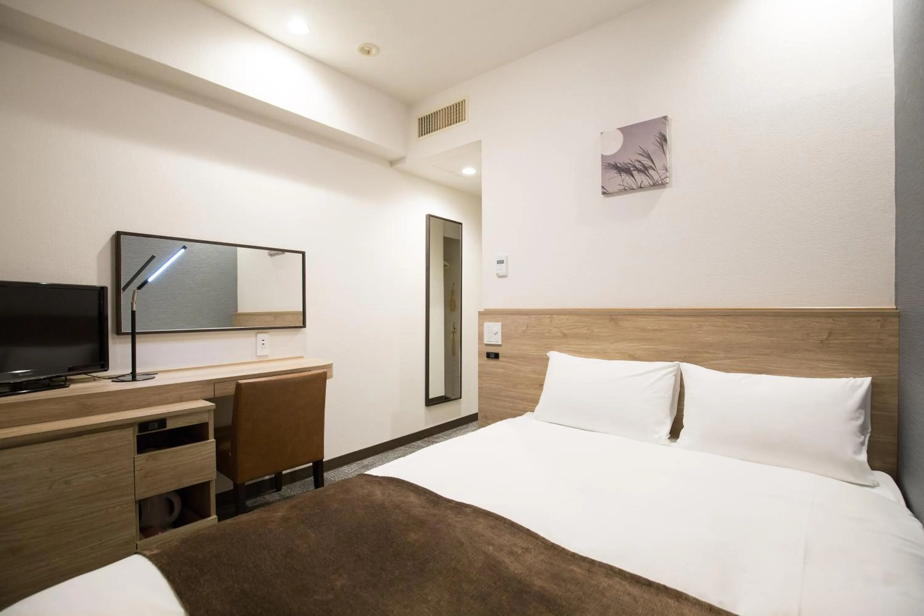 Photo of the whole room, Bed in Nest Hotel Osaka Shinsaibashi