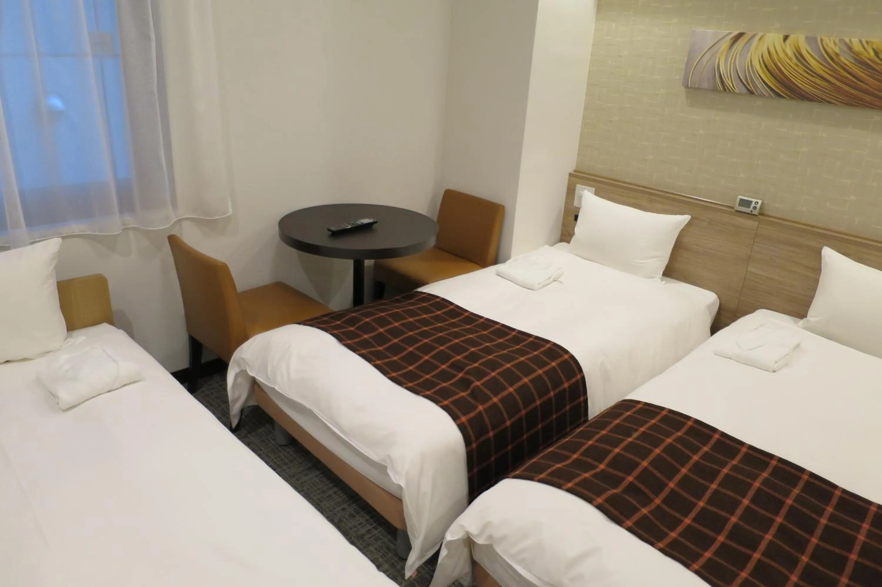 Photo of the whole room, Bed in Nest Hotel Osaka Shinsaibashi