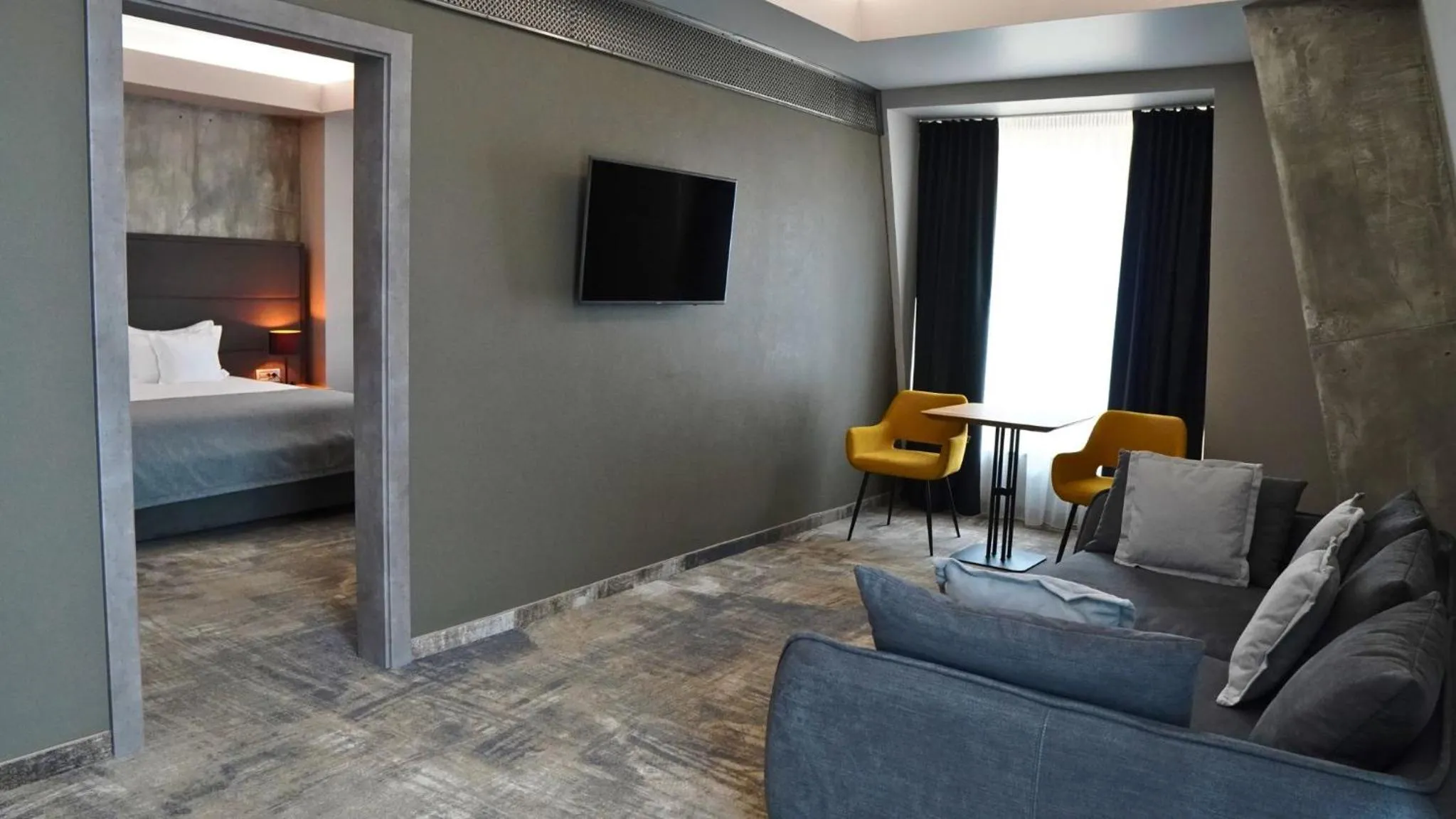 Living room, Bed in Aniroc Signature Hotel