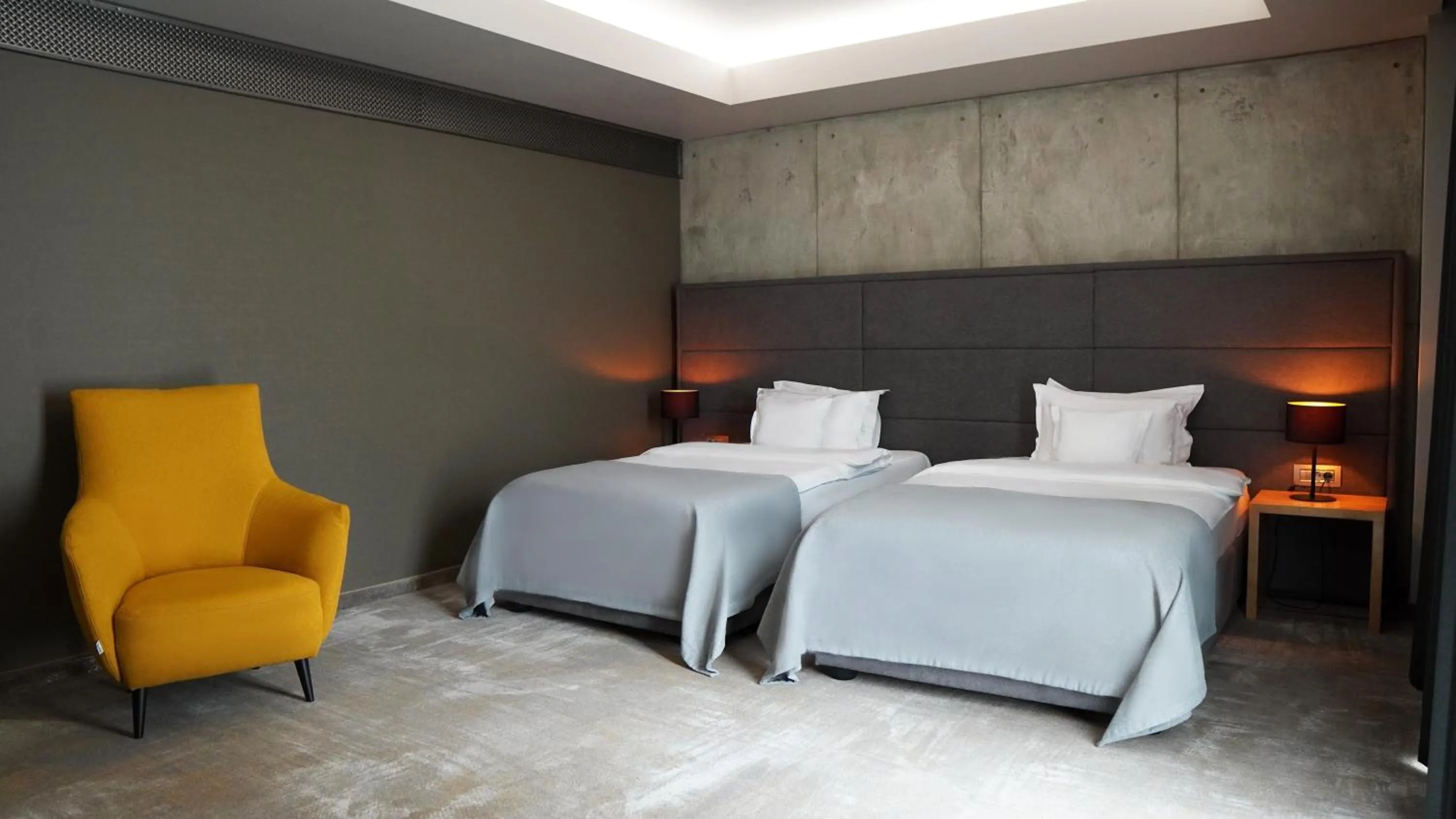 Seating area, Bed in Aniroc Signature Hotel
