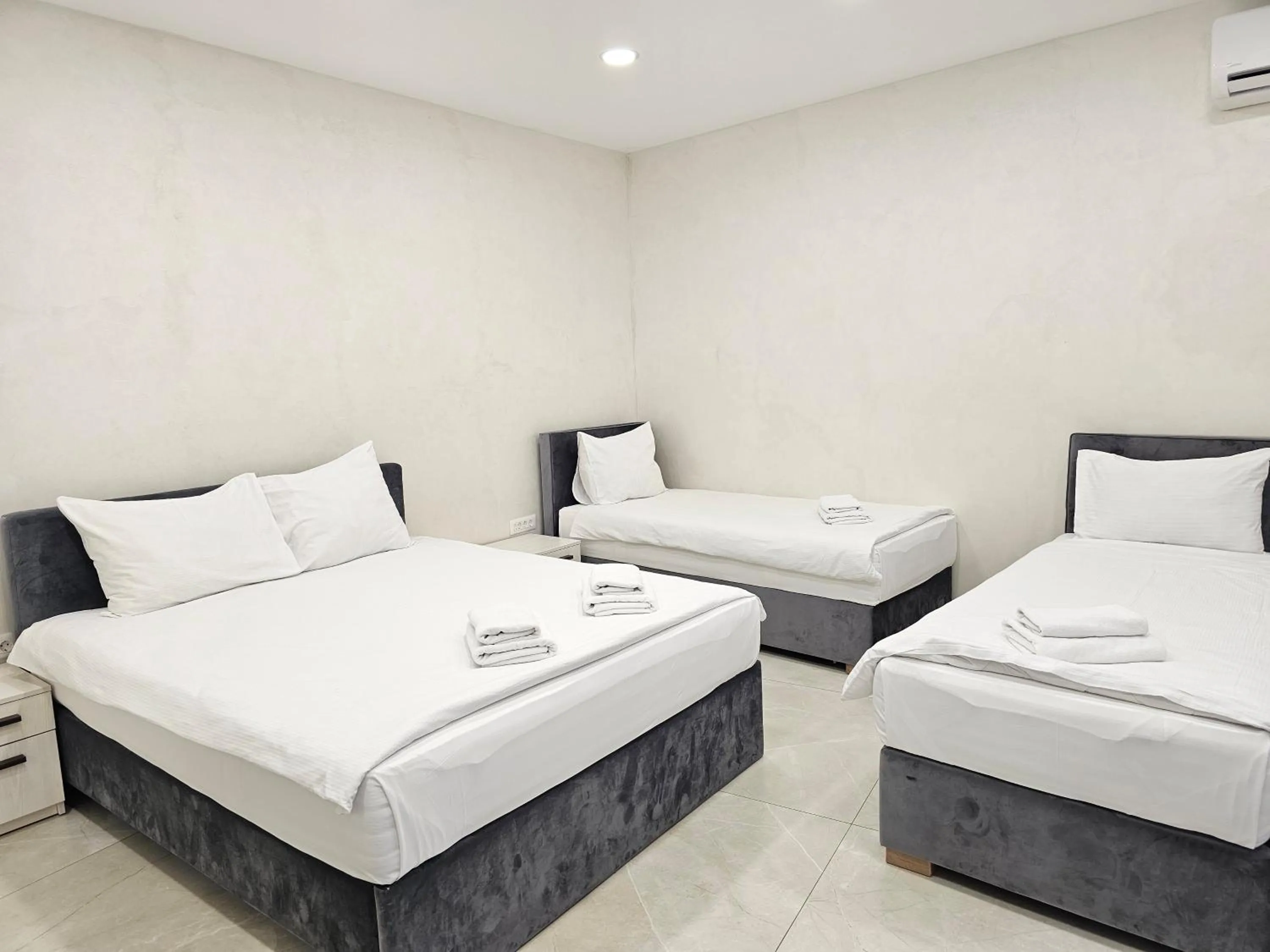 Bed in Ornament Hotel and Apartments