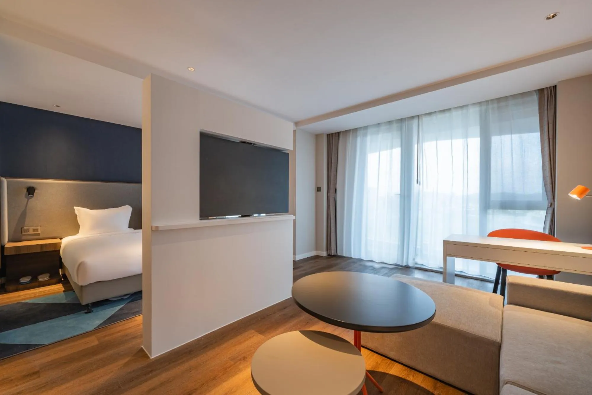 Living room, Bed in Holiday Inn Express Huludao Seaview by IHG