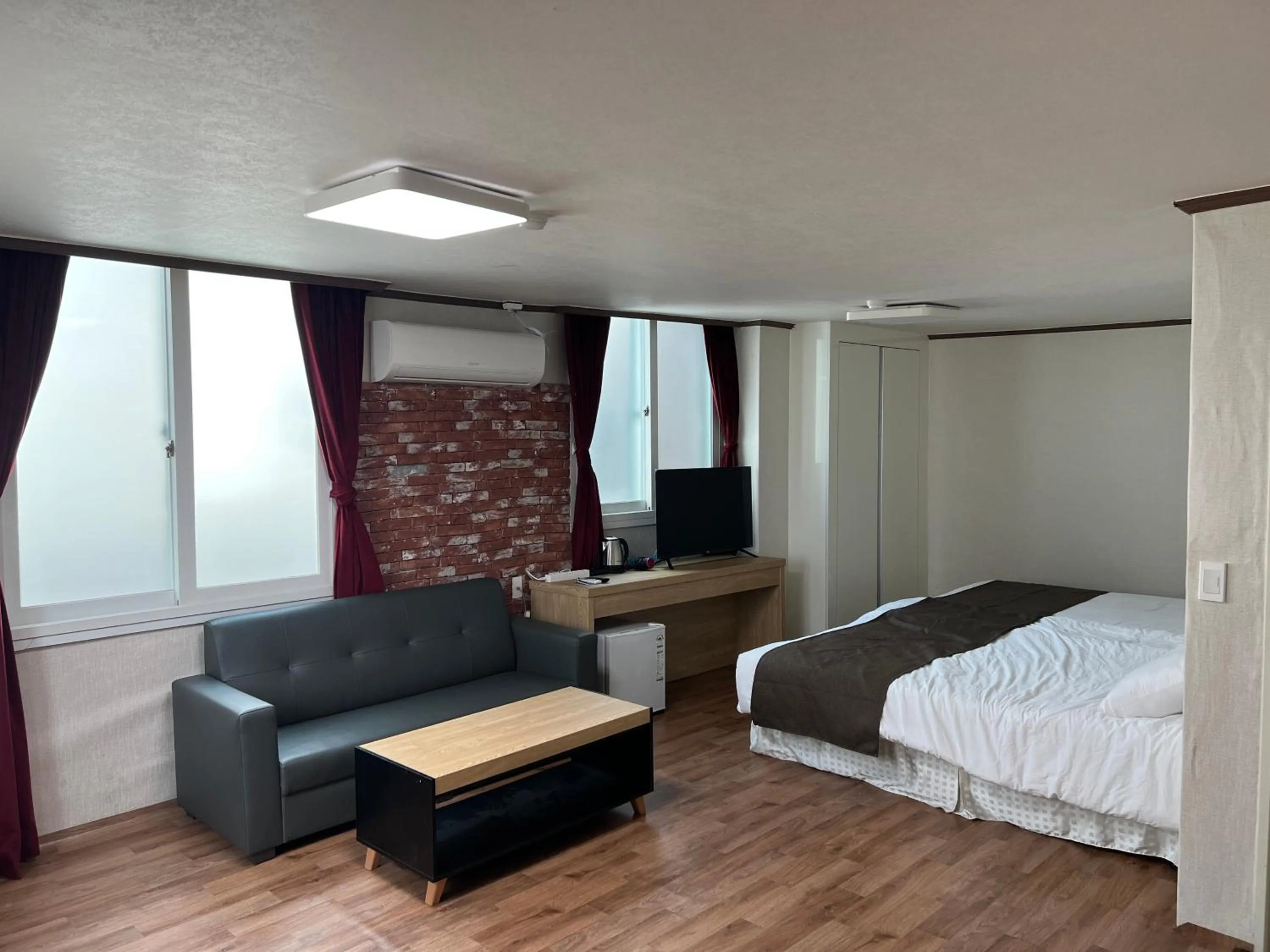 Living room, Bed in Bricks Stay Jeju City & Aiport