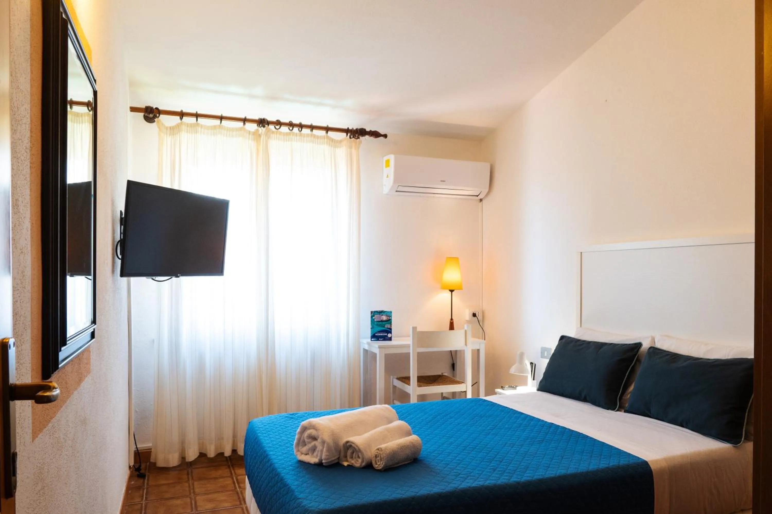 Bed in Hotel L'Aragosta