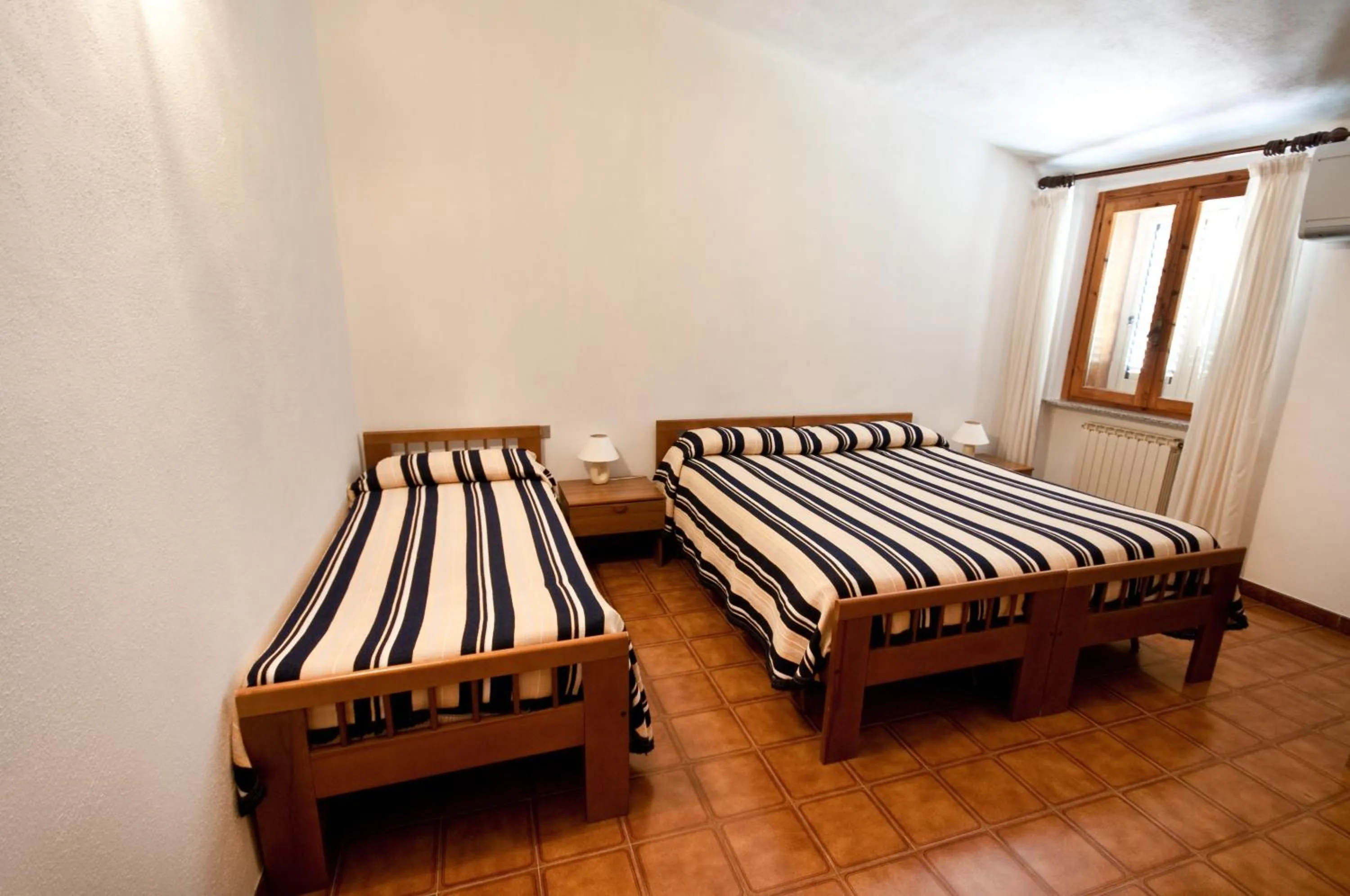 Bed in Hotel L'Aragosta