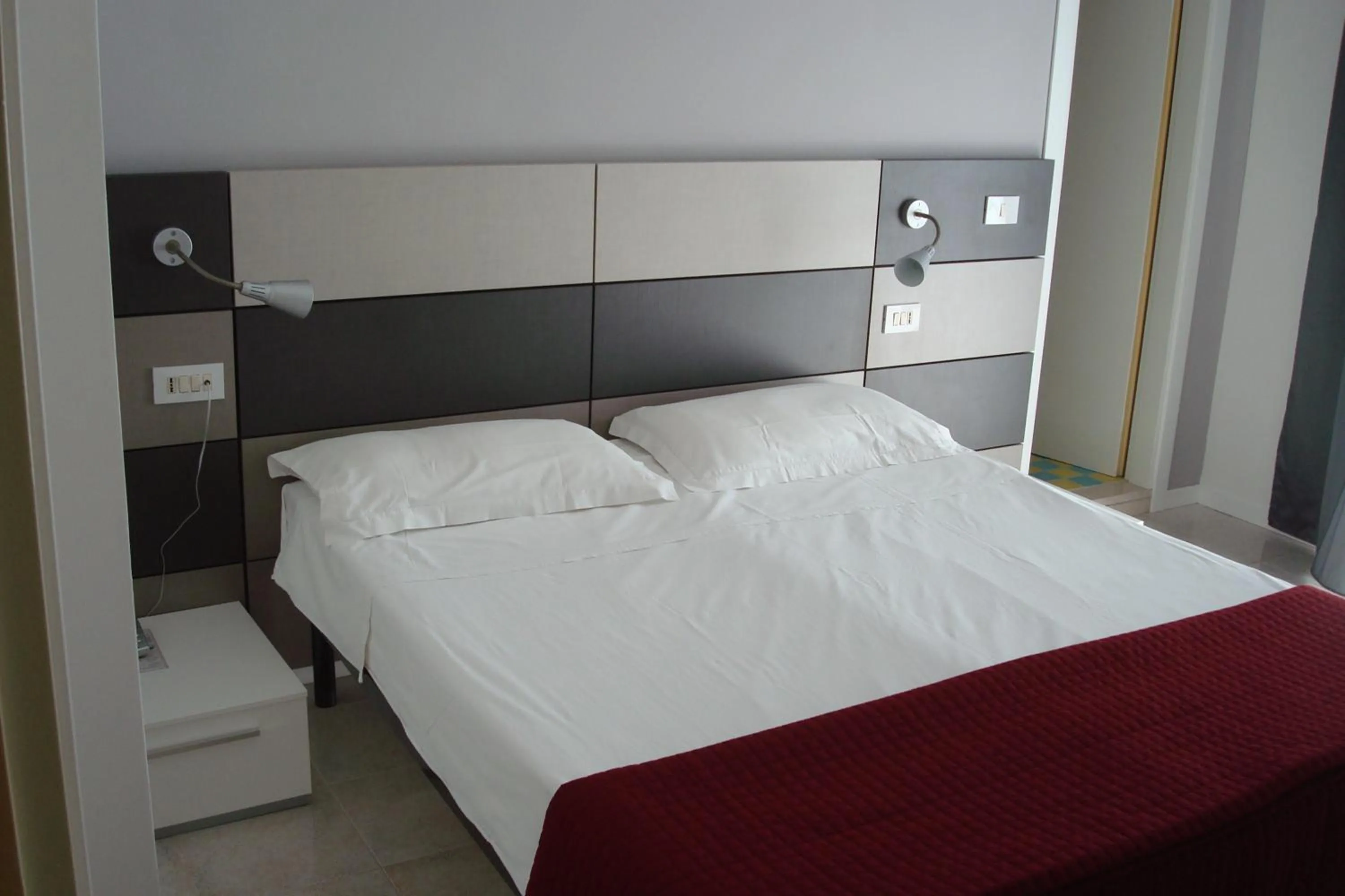 Bed in Hotel Gardenia