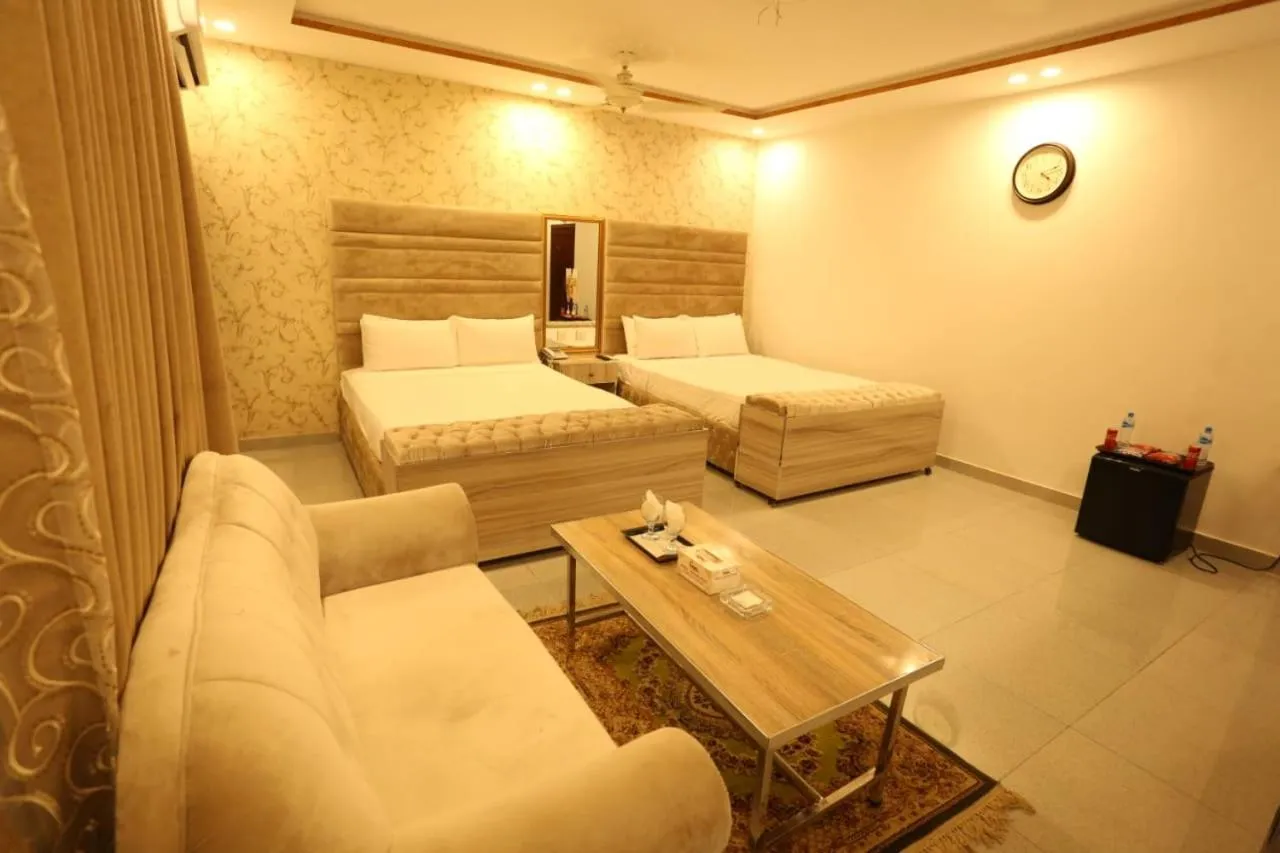 Bed in Grand Swiss Hotel&Apartment Lahore