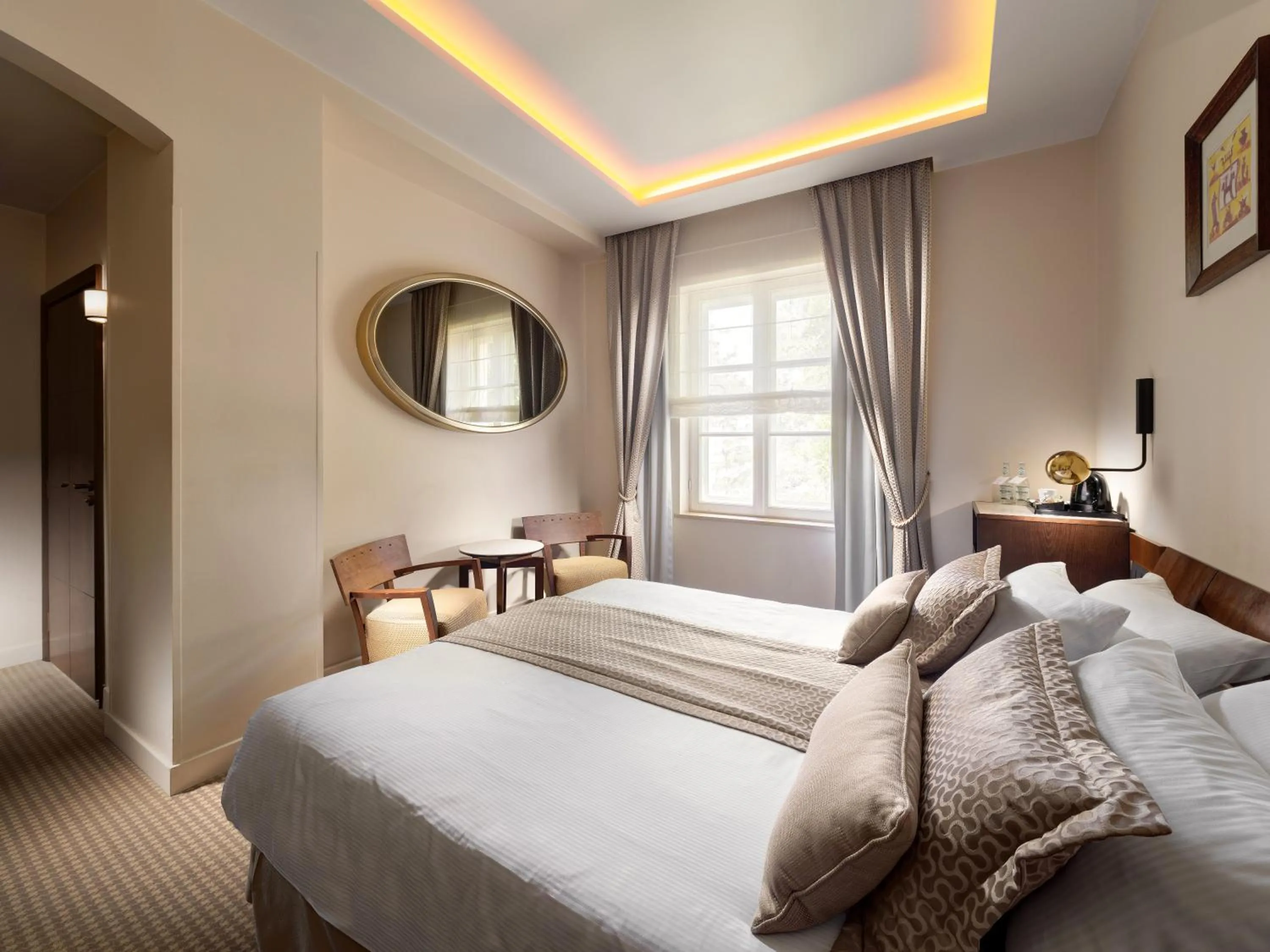 Bed in Mamaison Le Regina Boutique Hotel