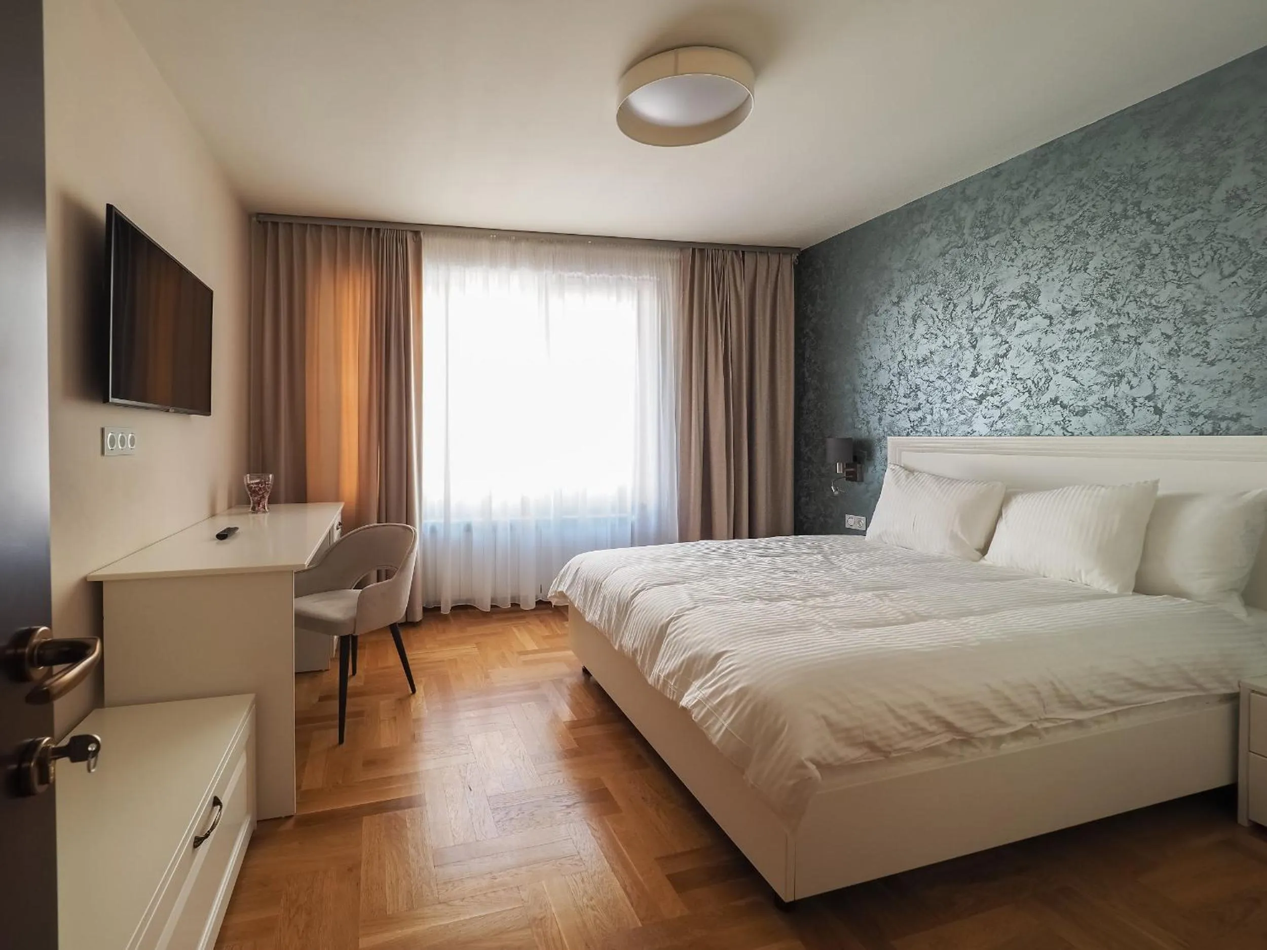 Photo of the whole room, Bed in Boutique Central