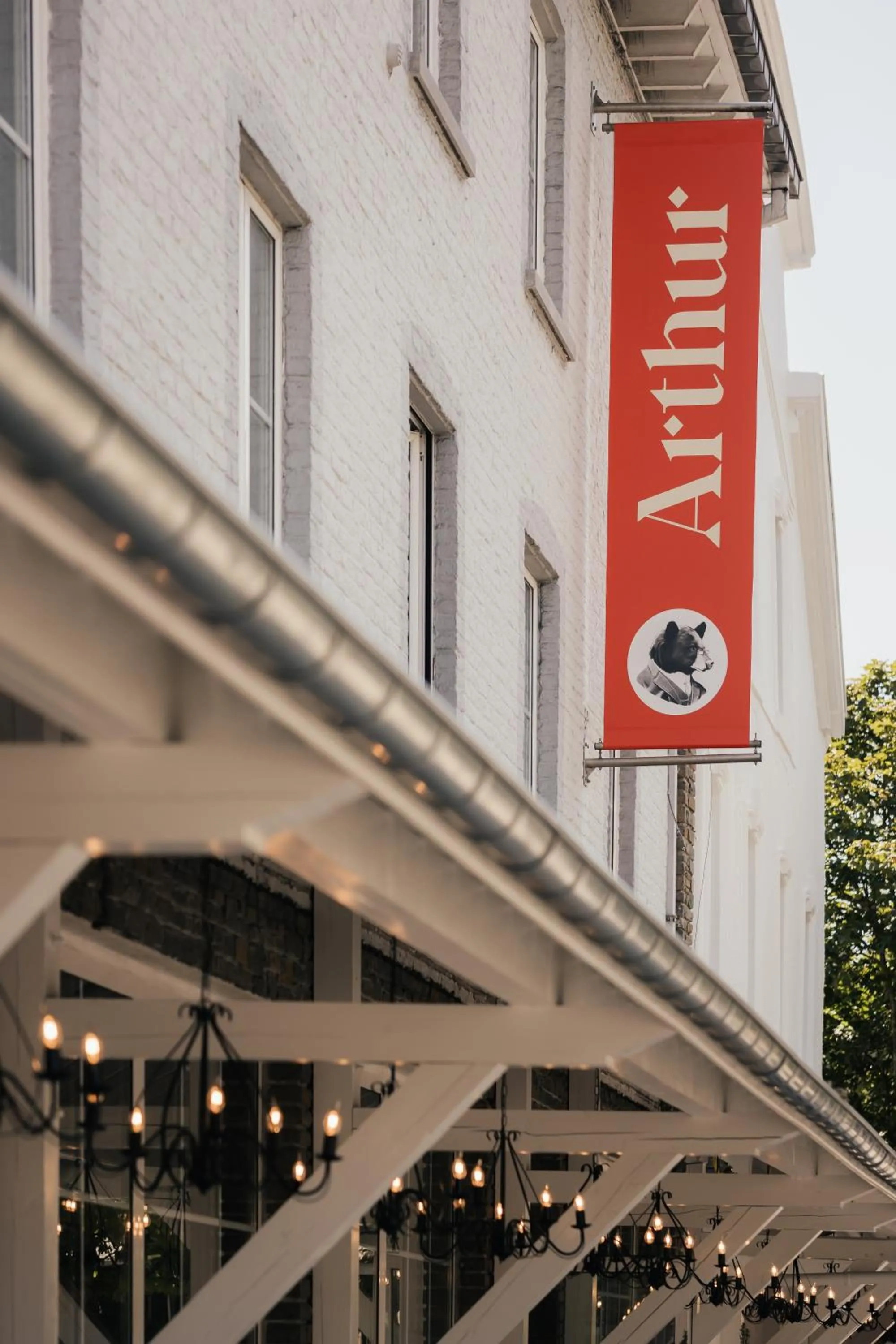 Property logo or sign in Hotel Au lit des ours