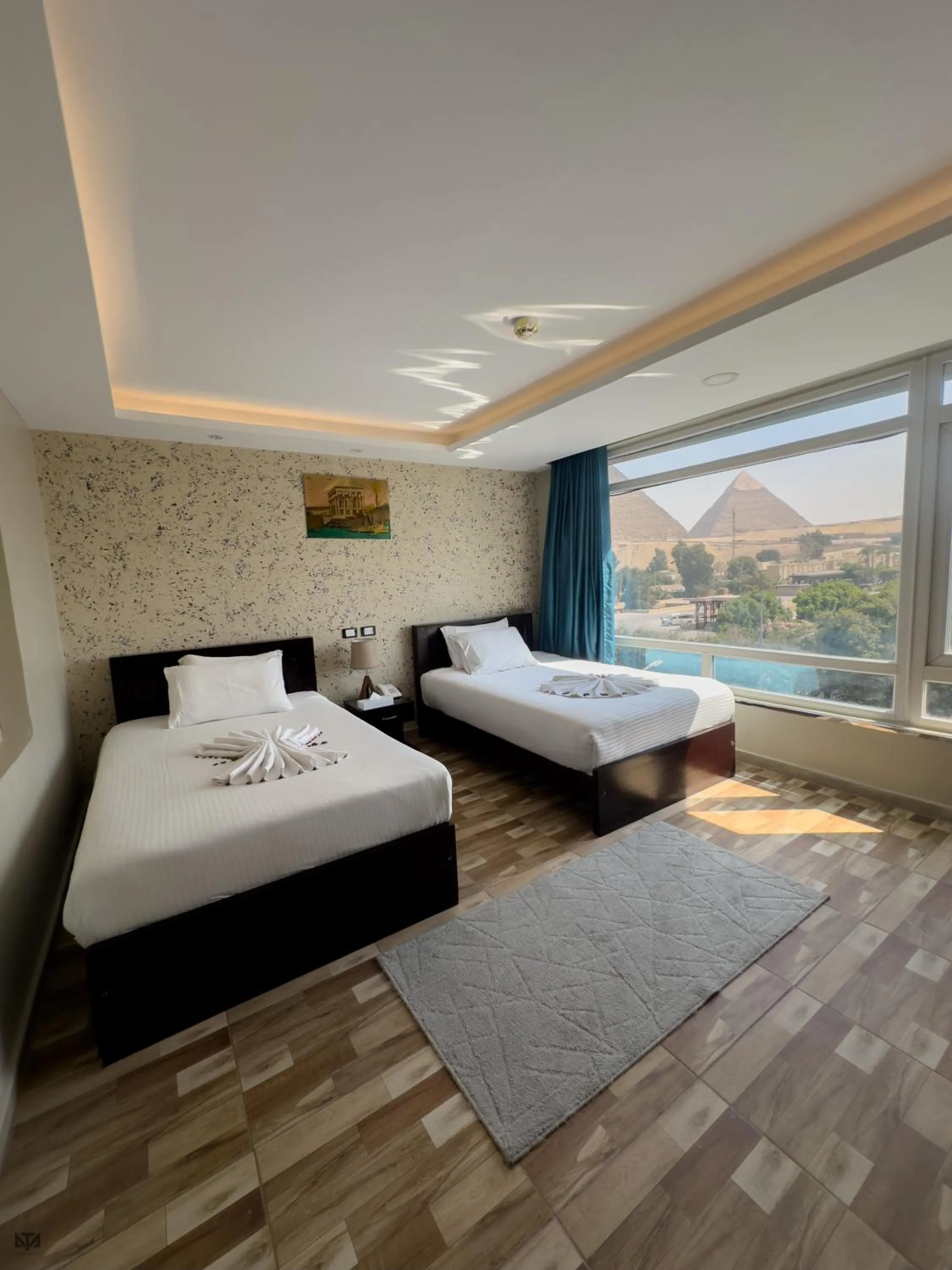 Bed in Turquoise Pyramids & Grand Egyptian museum view Hotel